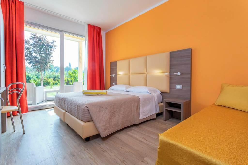 Camera Familiare con Giardino Privato
