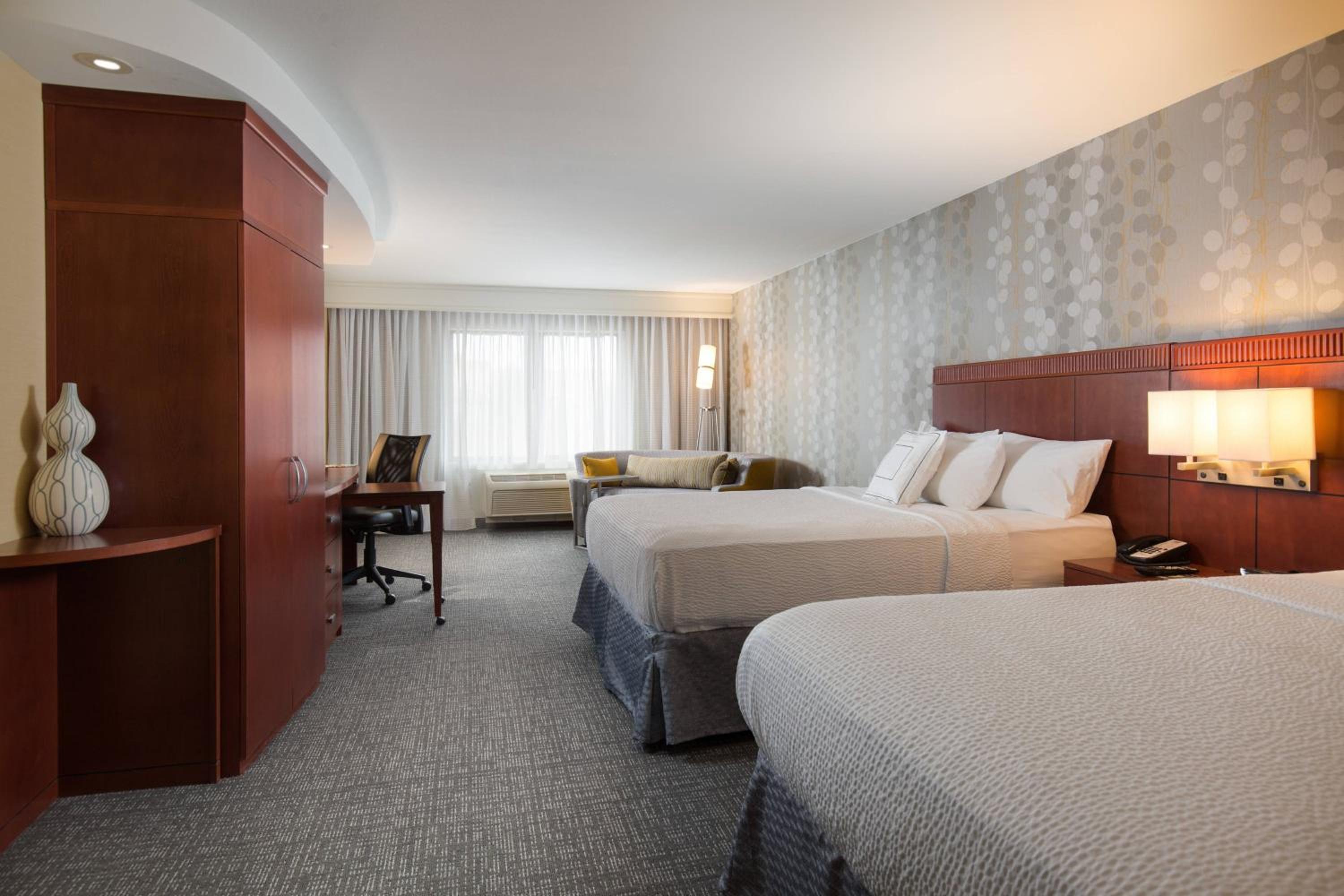 Queen Room with Two Queen Beds and Sofa Bed - Photo 1