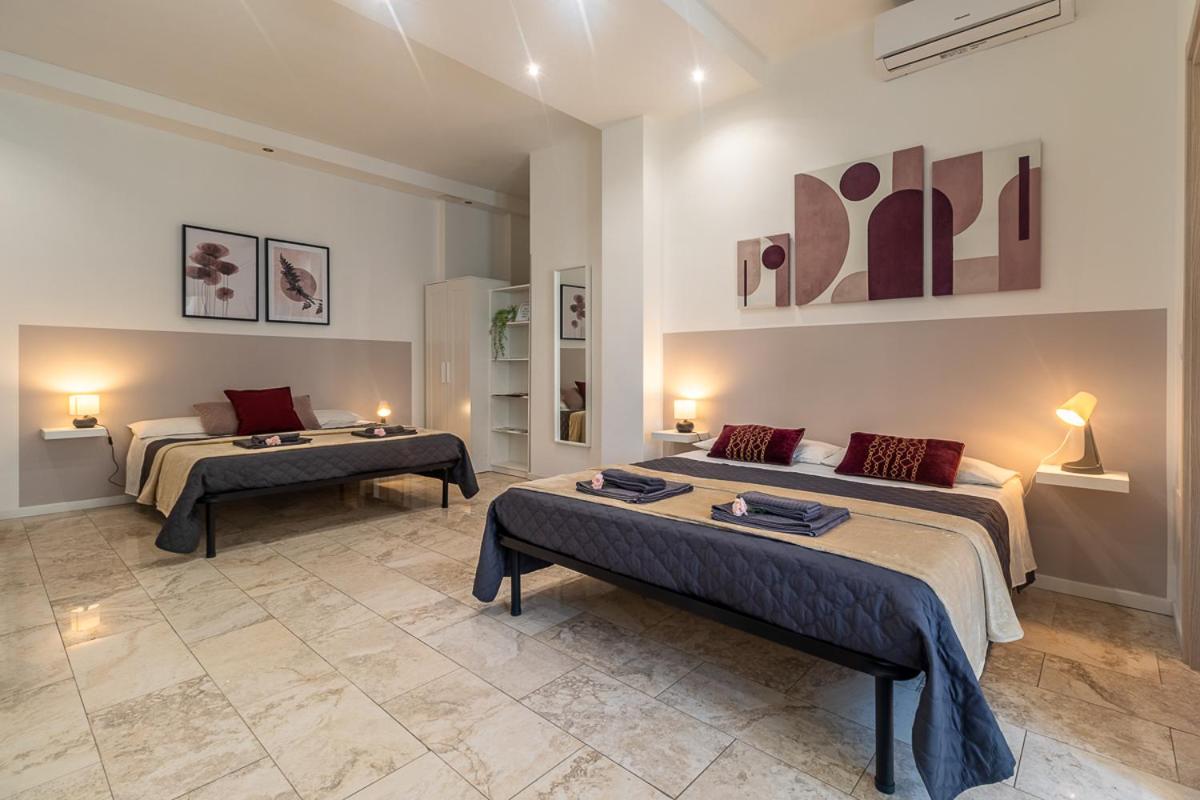 Quadruple Room with Balcony - Photo 1