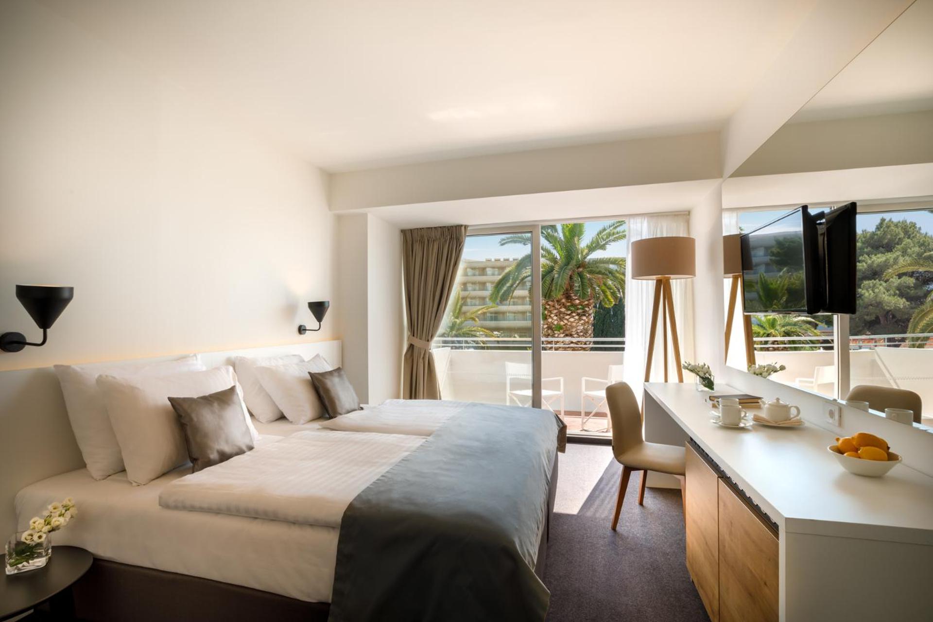 Relax in luxury with serene views of the palm trees.