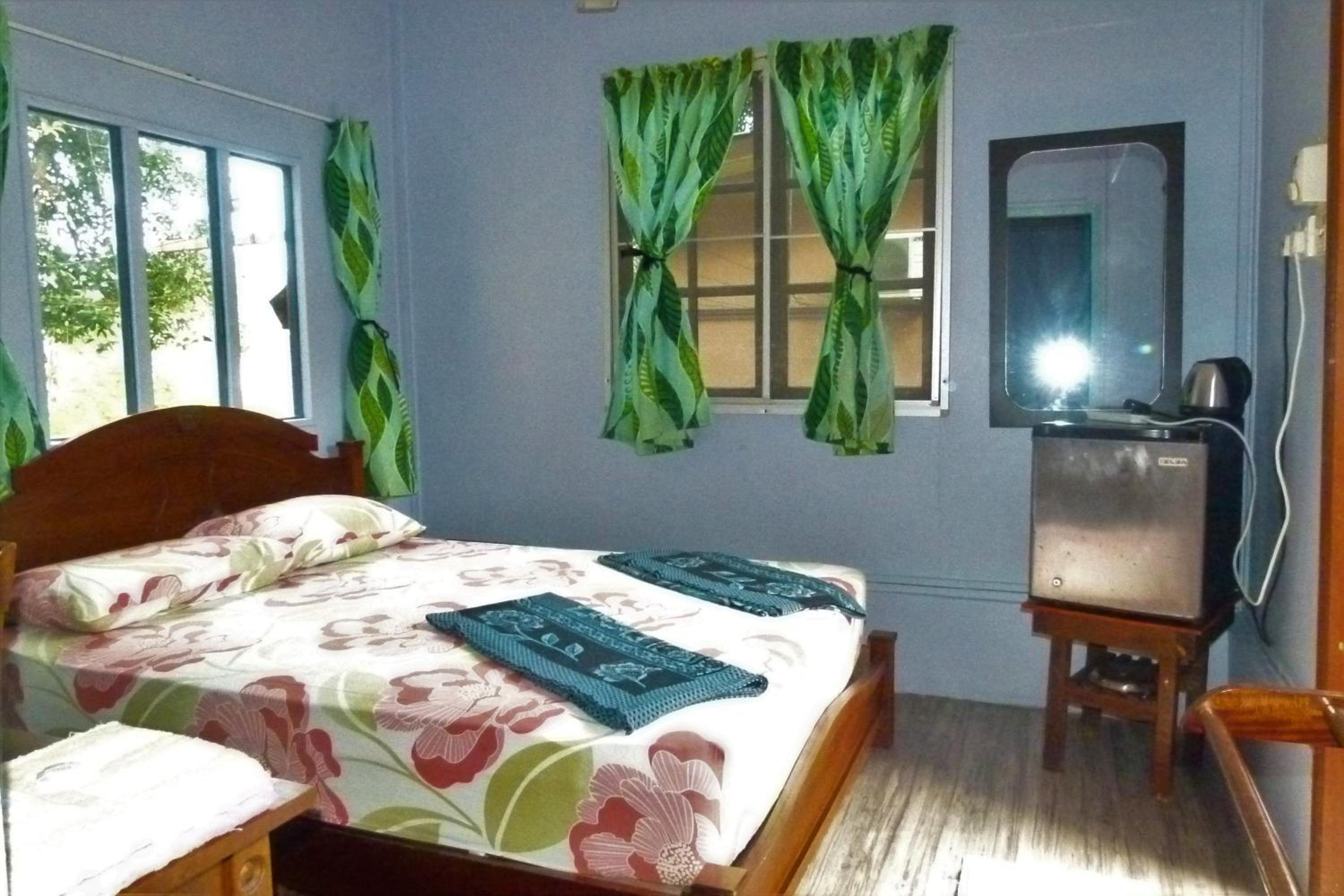 Fan Queen Bed Room with Private Shower Room photo 1