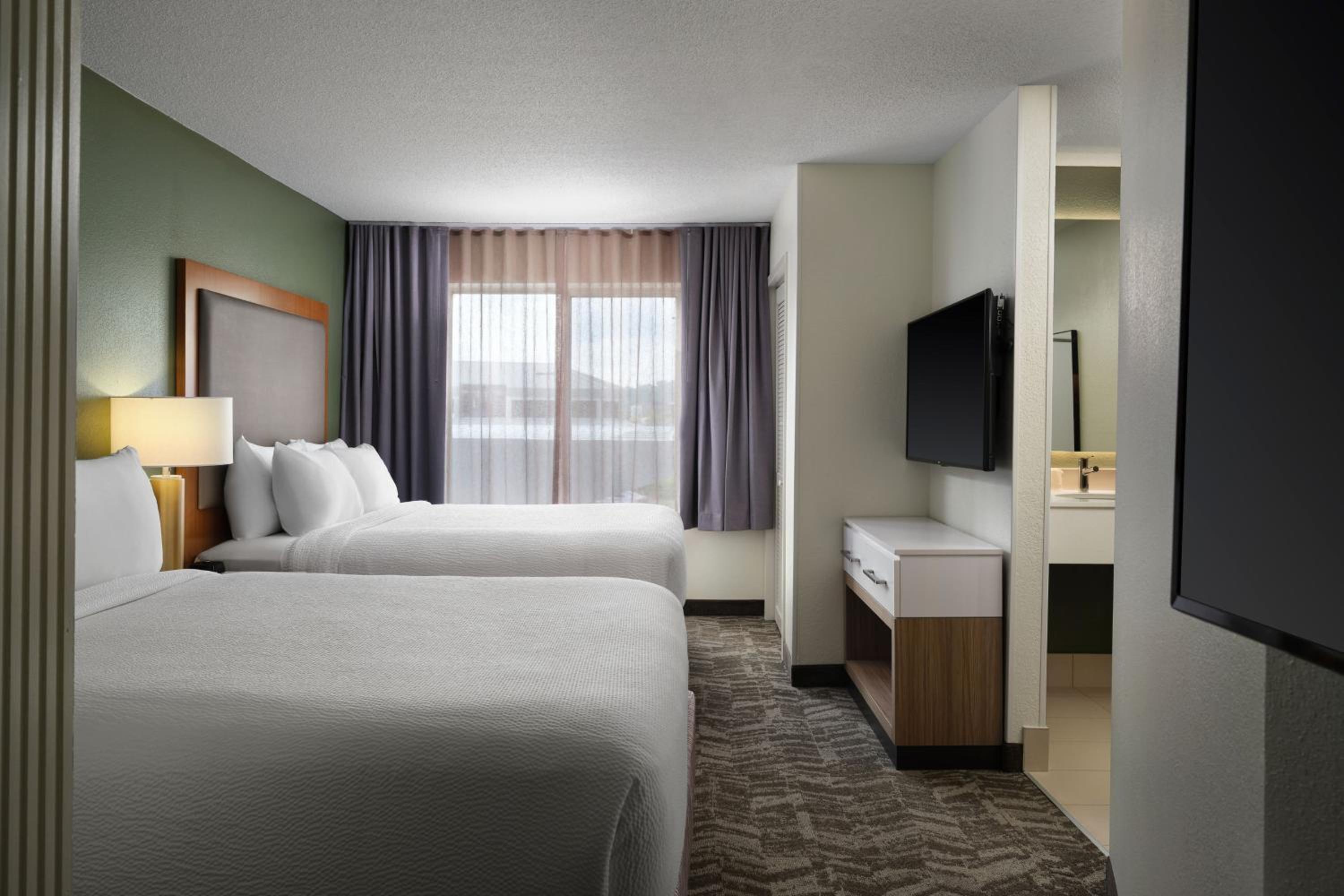 Queen Suite with Two Queen Beds and Sofa Bed - Photo 1