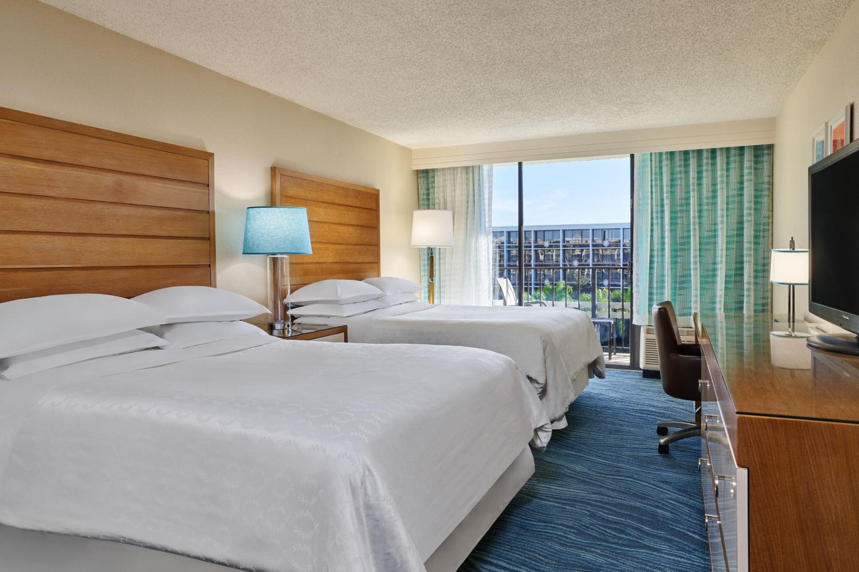Queen Room with Two Queen Beds - Pool View photo 1