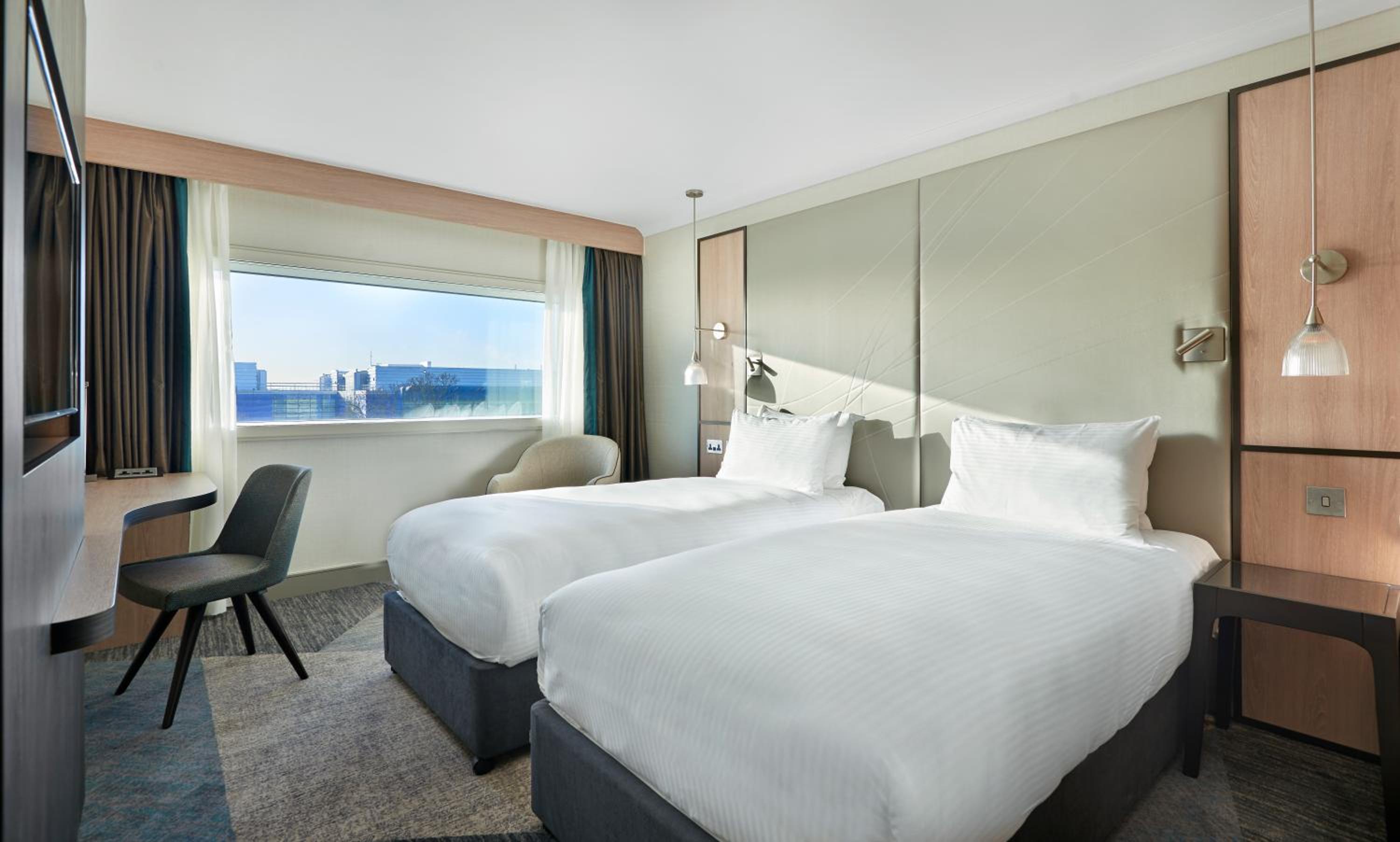 Twin Room with Runway View - Photo 1
