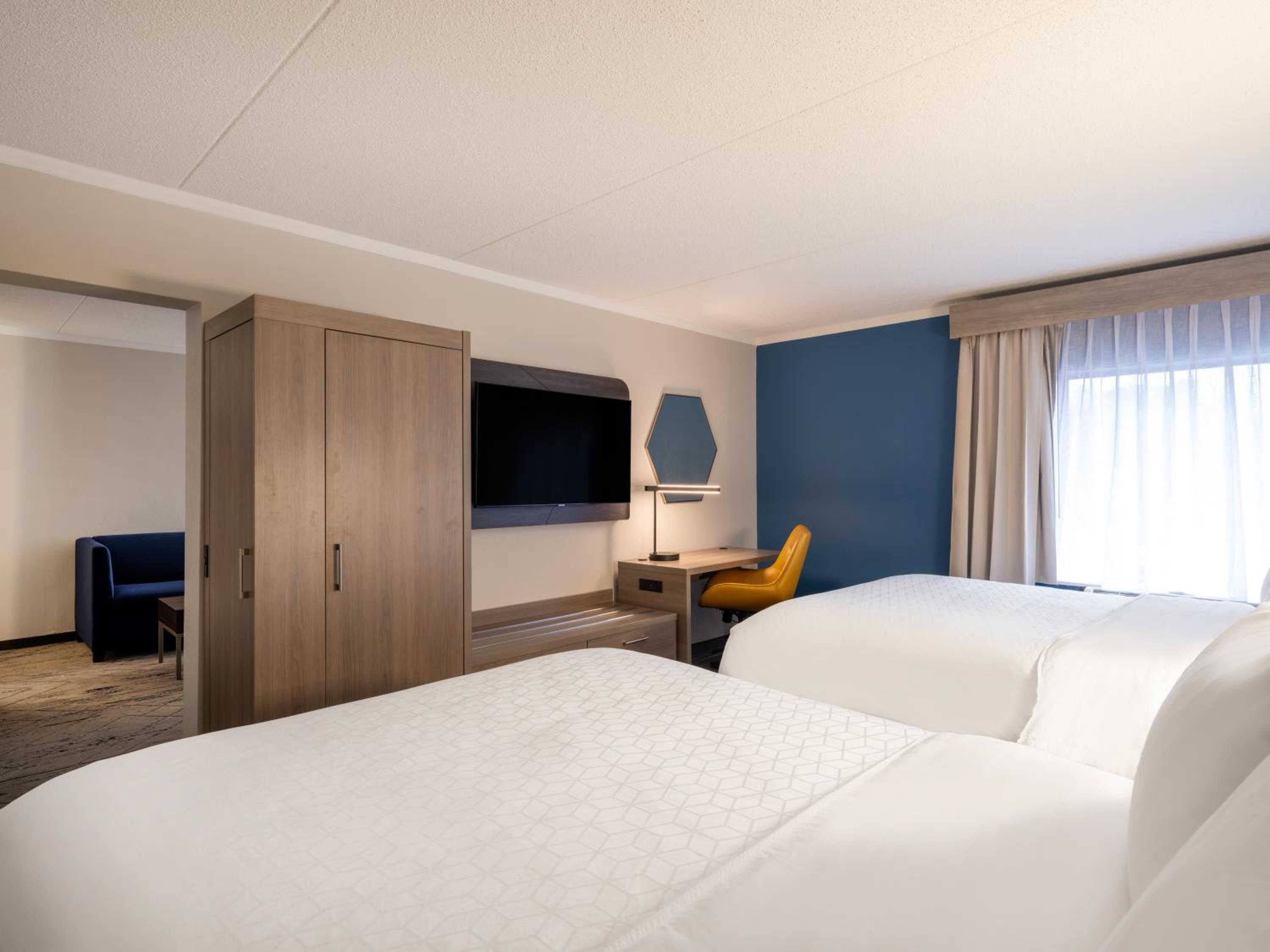 Queen Suite with Two Queen Beds and Sofa Bed - Photo 1