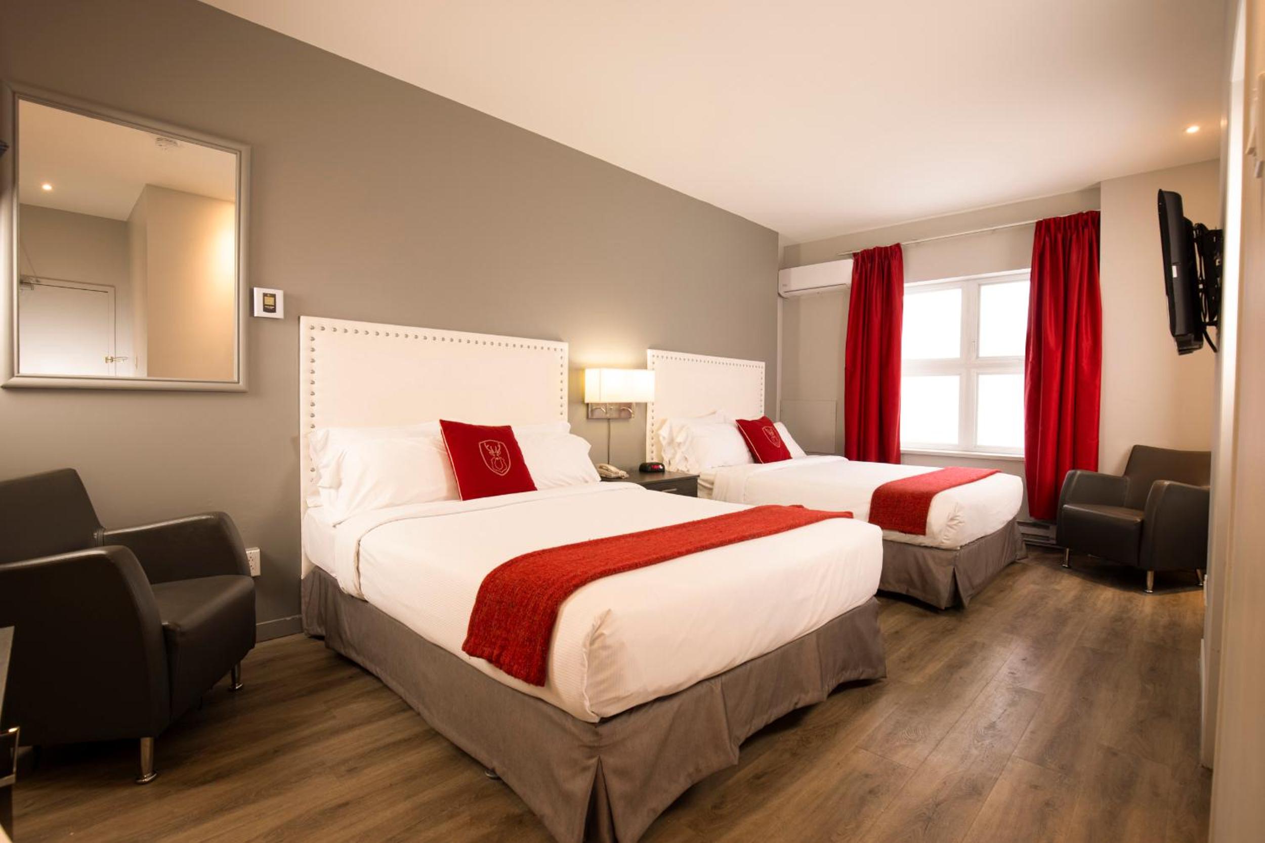 Queen Room with Two Queen Beds - Photo 1