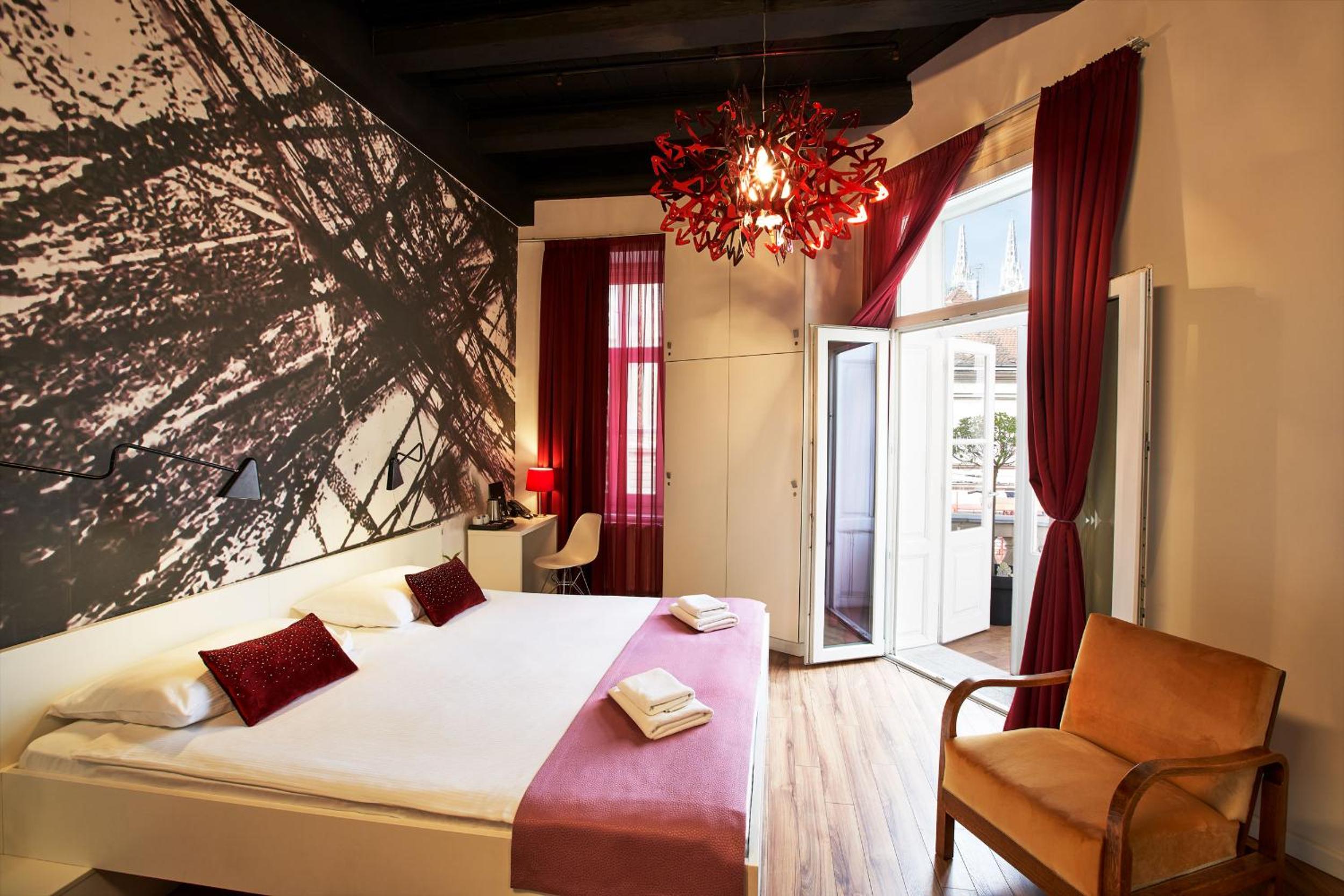 Deluxe Double Room with Balcony with City View - Photo 1