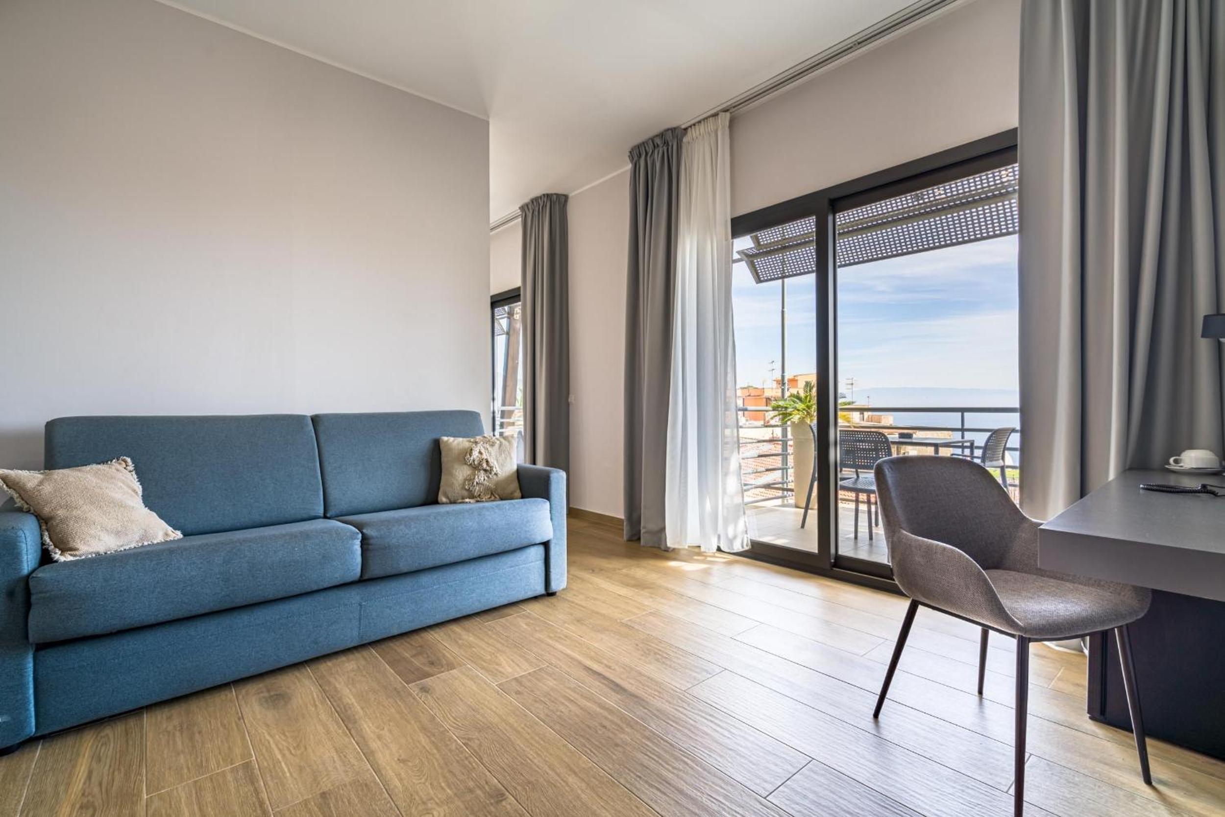 Family Room with Balcony and Partial Sea View thumbnail 6