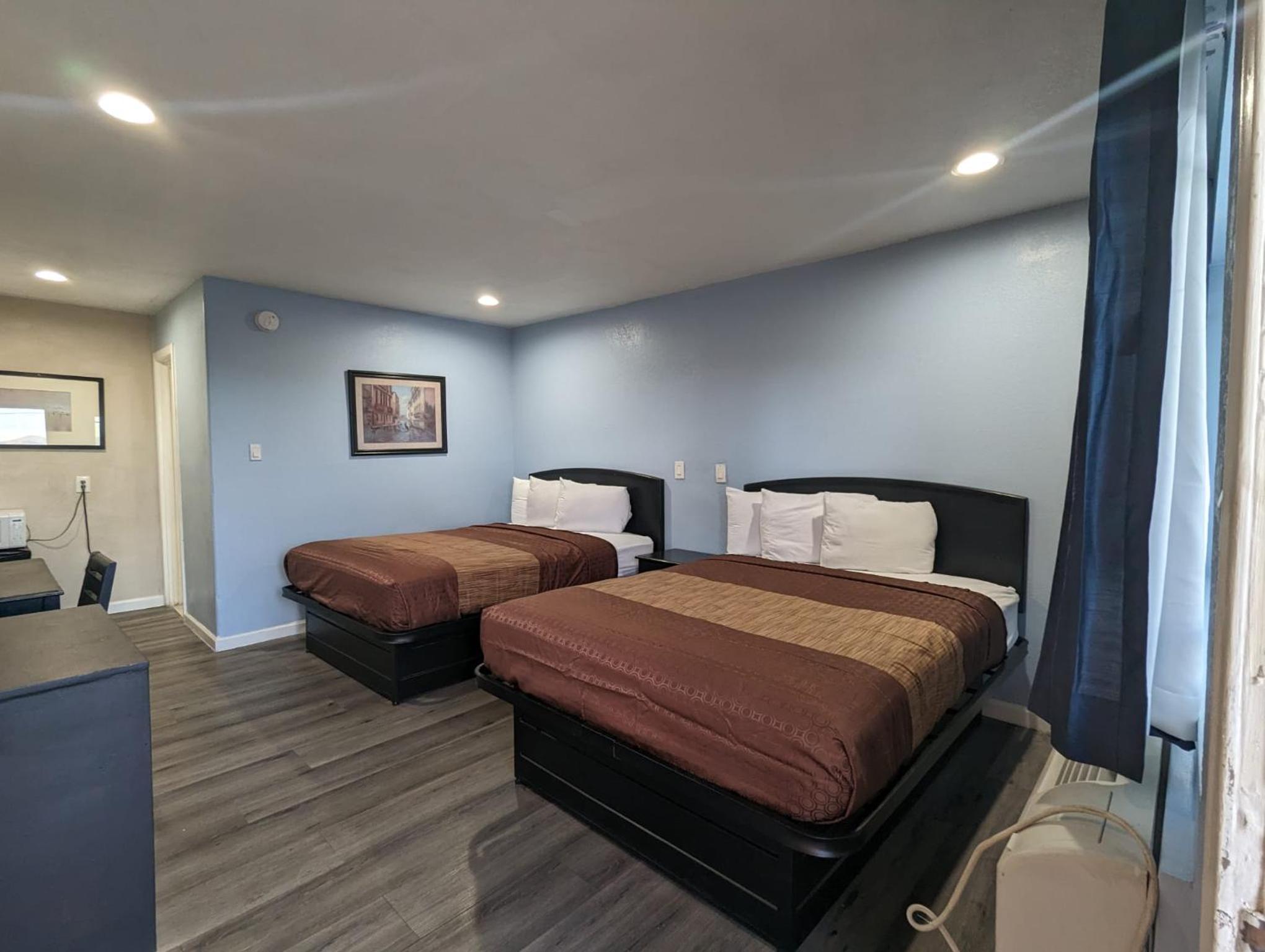 Queen Room with Two Queen Beds - Photo 1