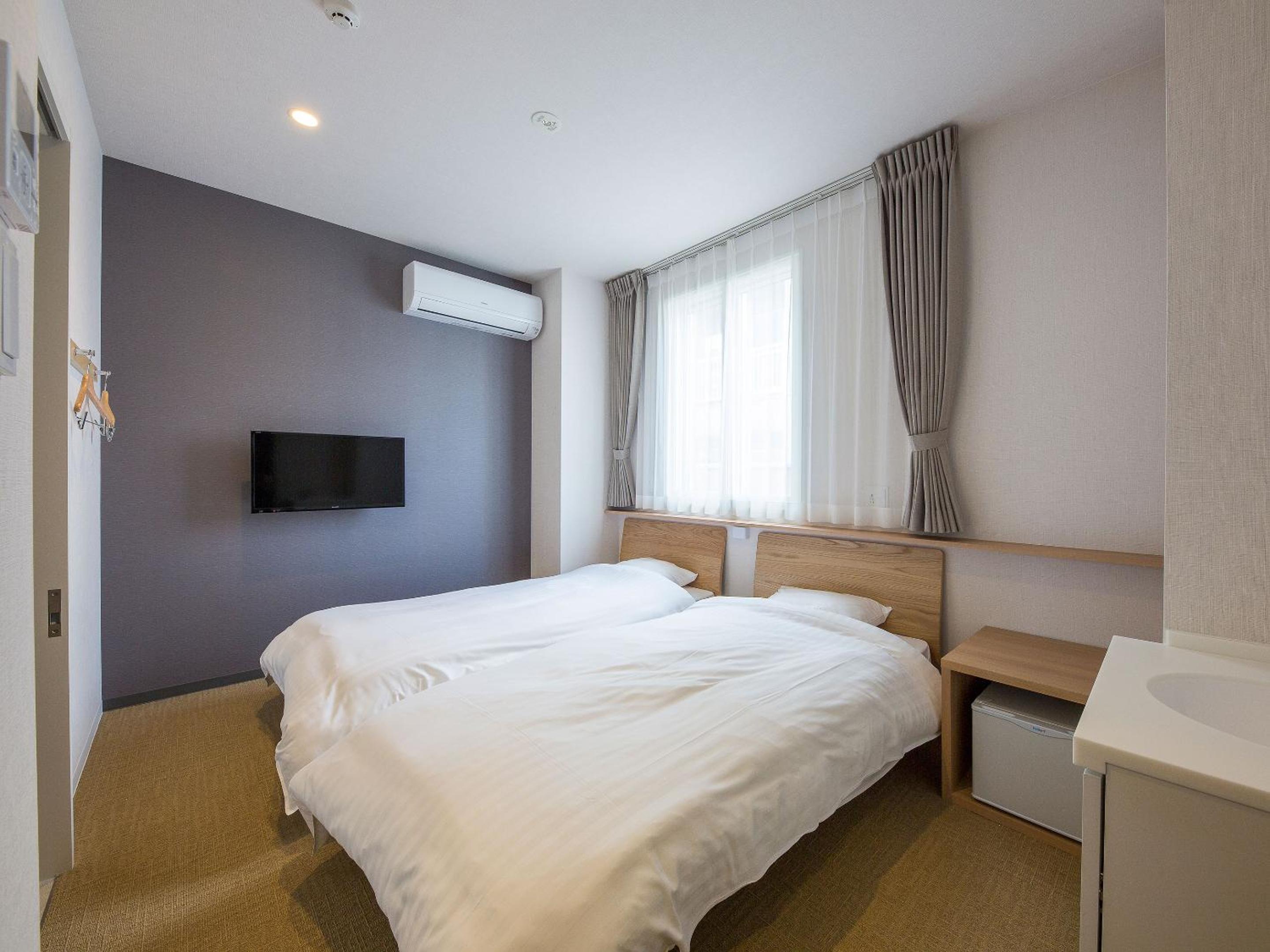 Twin Room with Private Bathroom - Photo 1