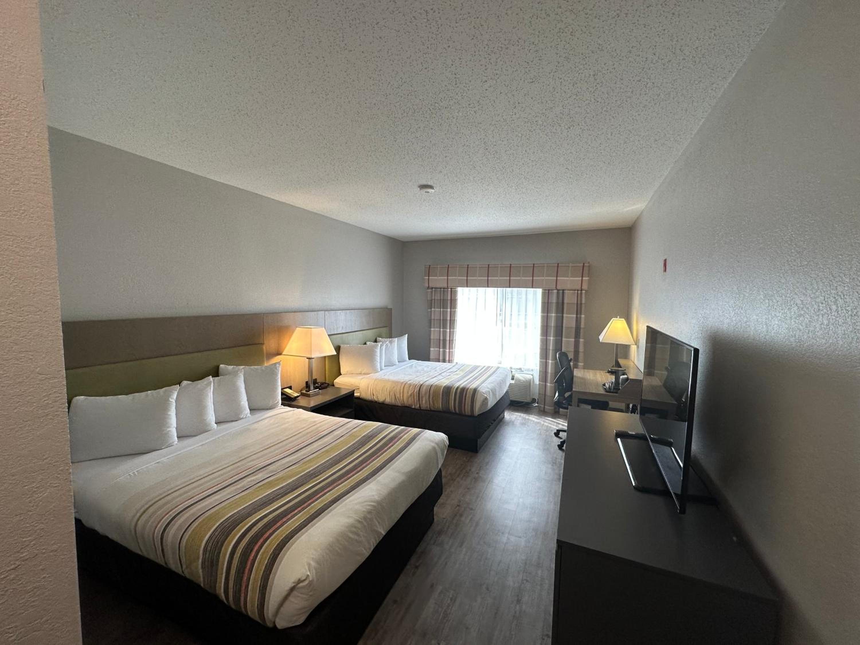 Queen Room with Two Queen Beds - Non-Smoking - Photo 1
