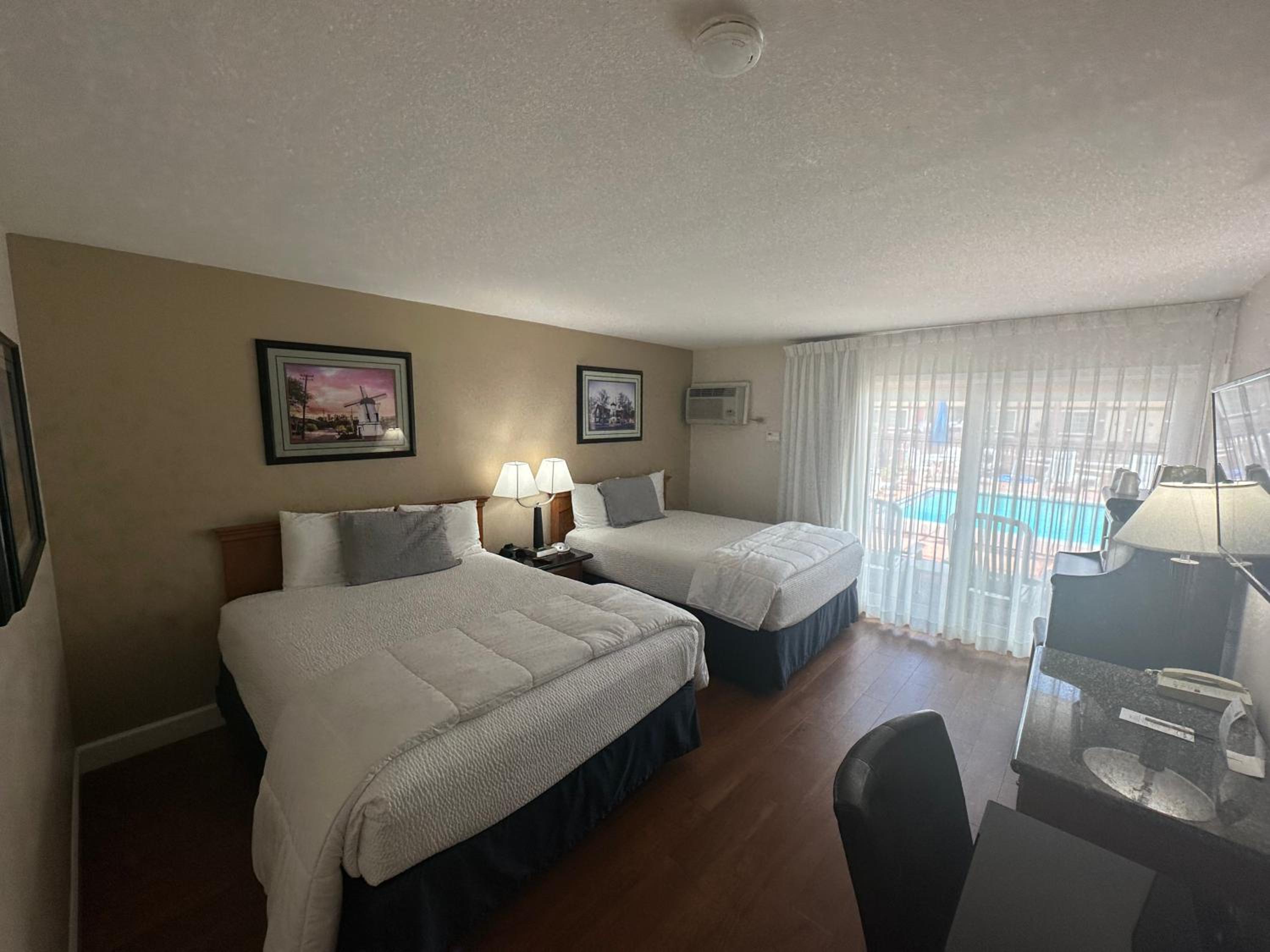 Deluxe Queen Room with Two Queen Beds (Balcony) - Photo 2