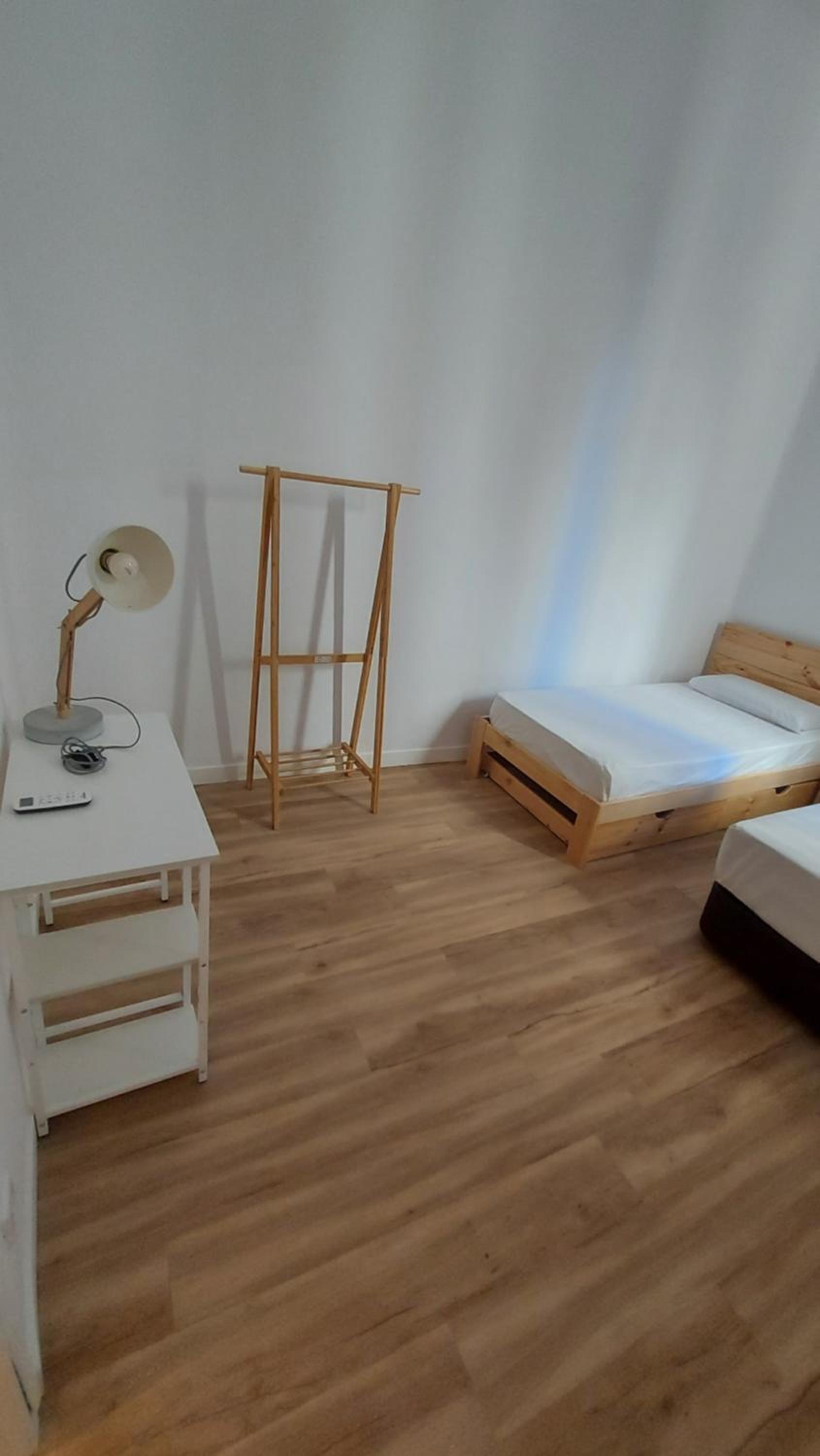 Habitación Triple con Baño Compartido