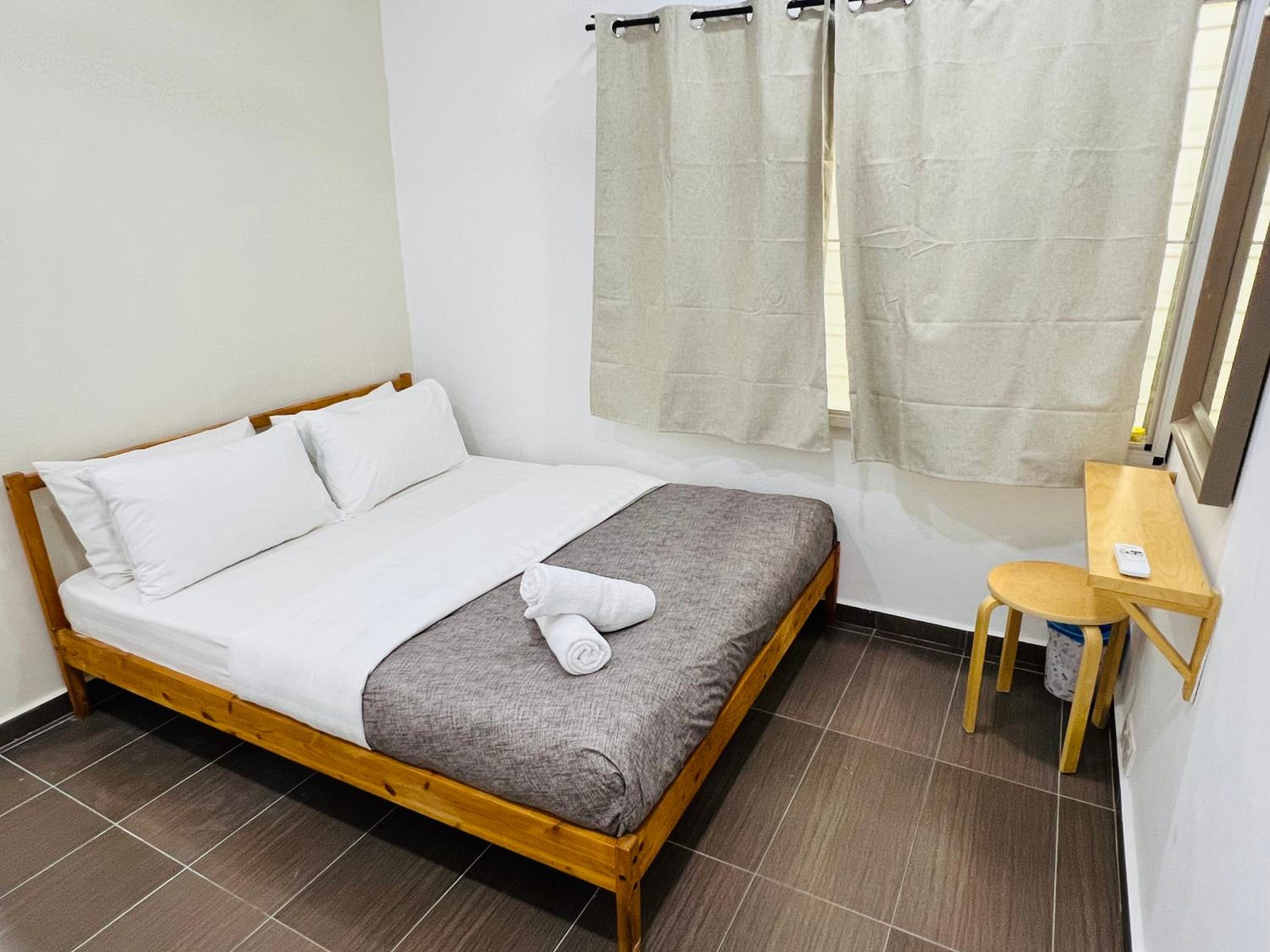Three-Bedroom House - Photo 31