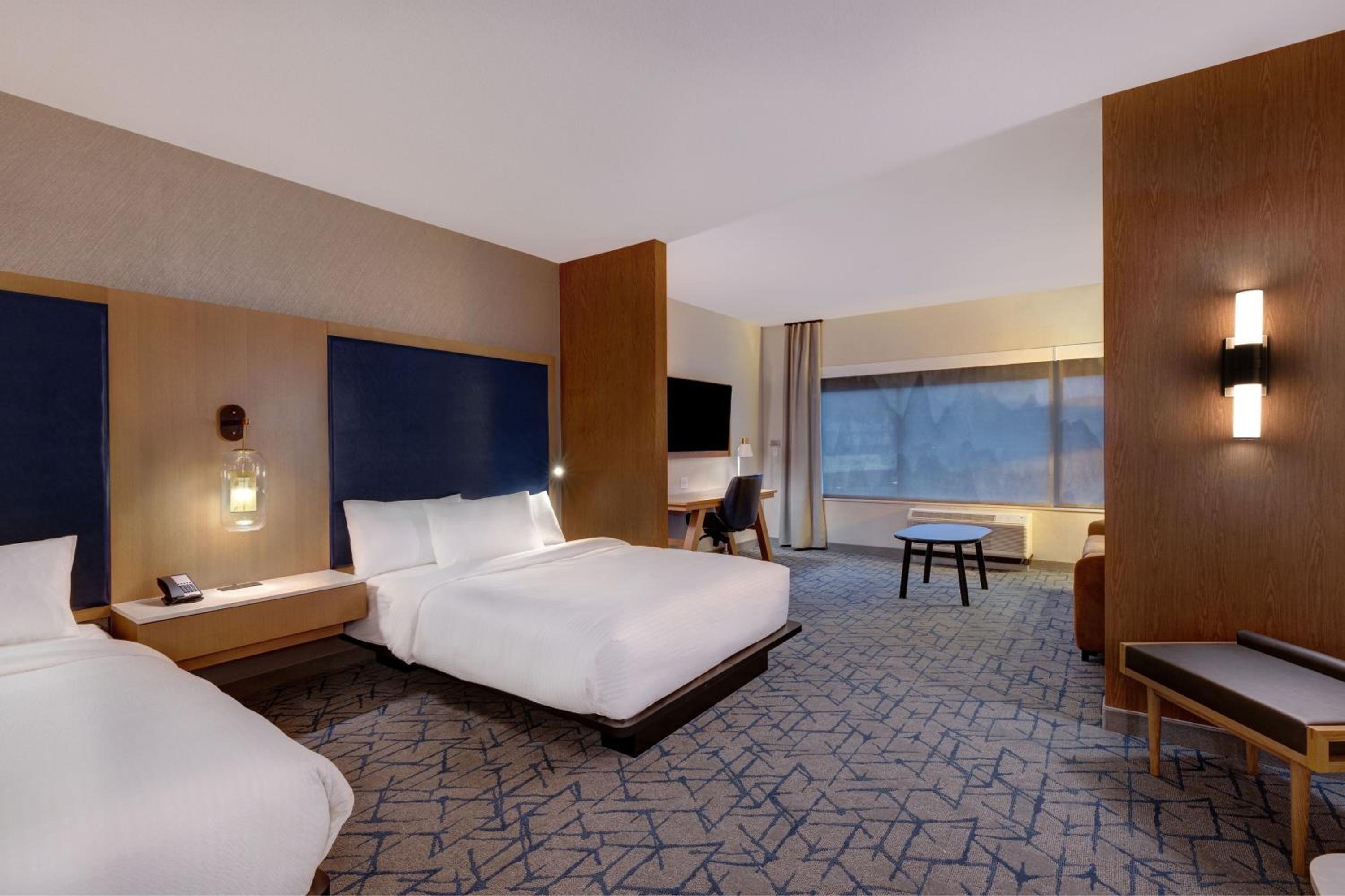 Queen Suite with Two Queen Beds and Sofa Bed - Photo 5