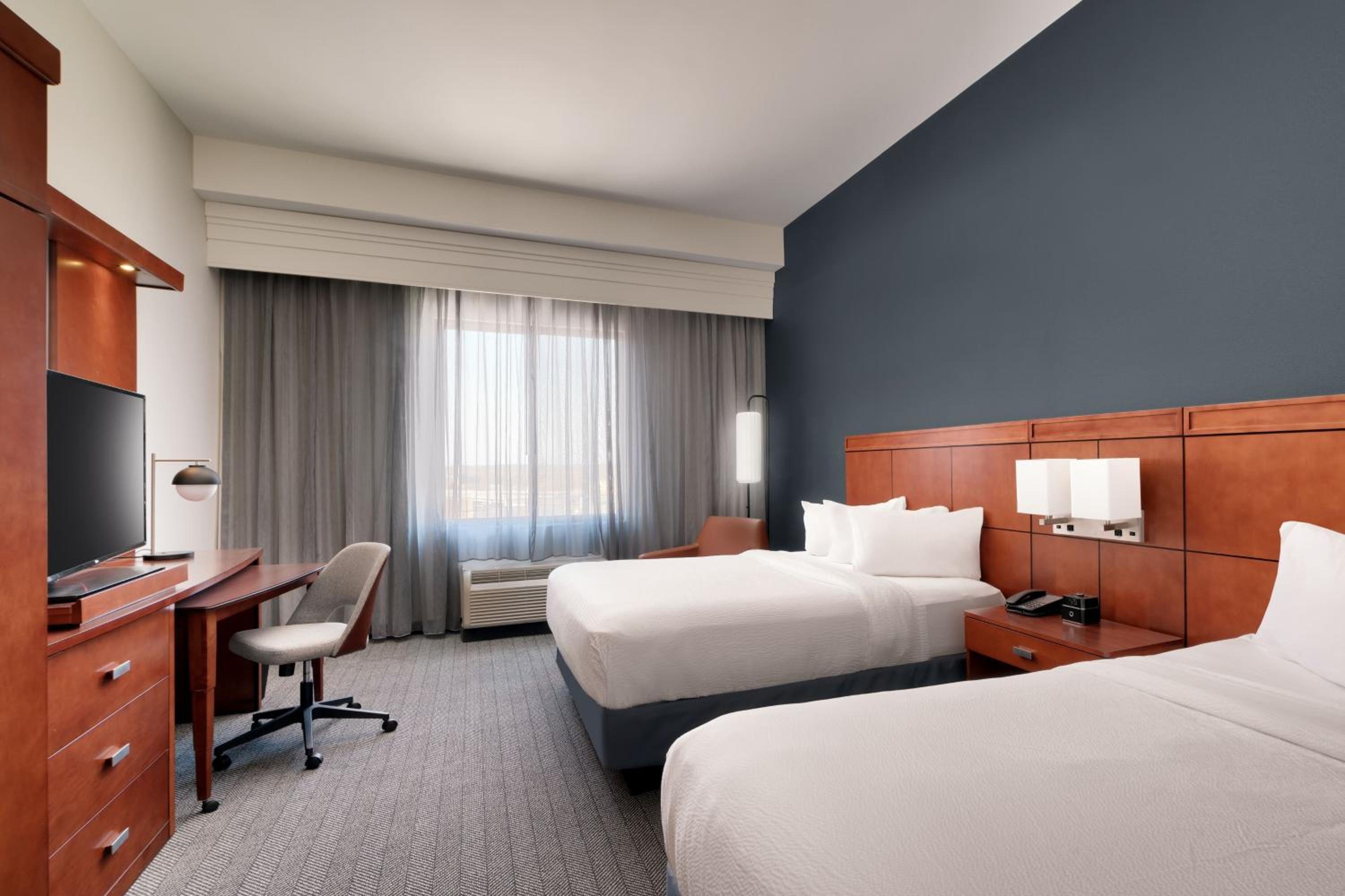 Queen Room with Two Queen Beds - Hearing Accessible photo 1