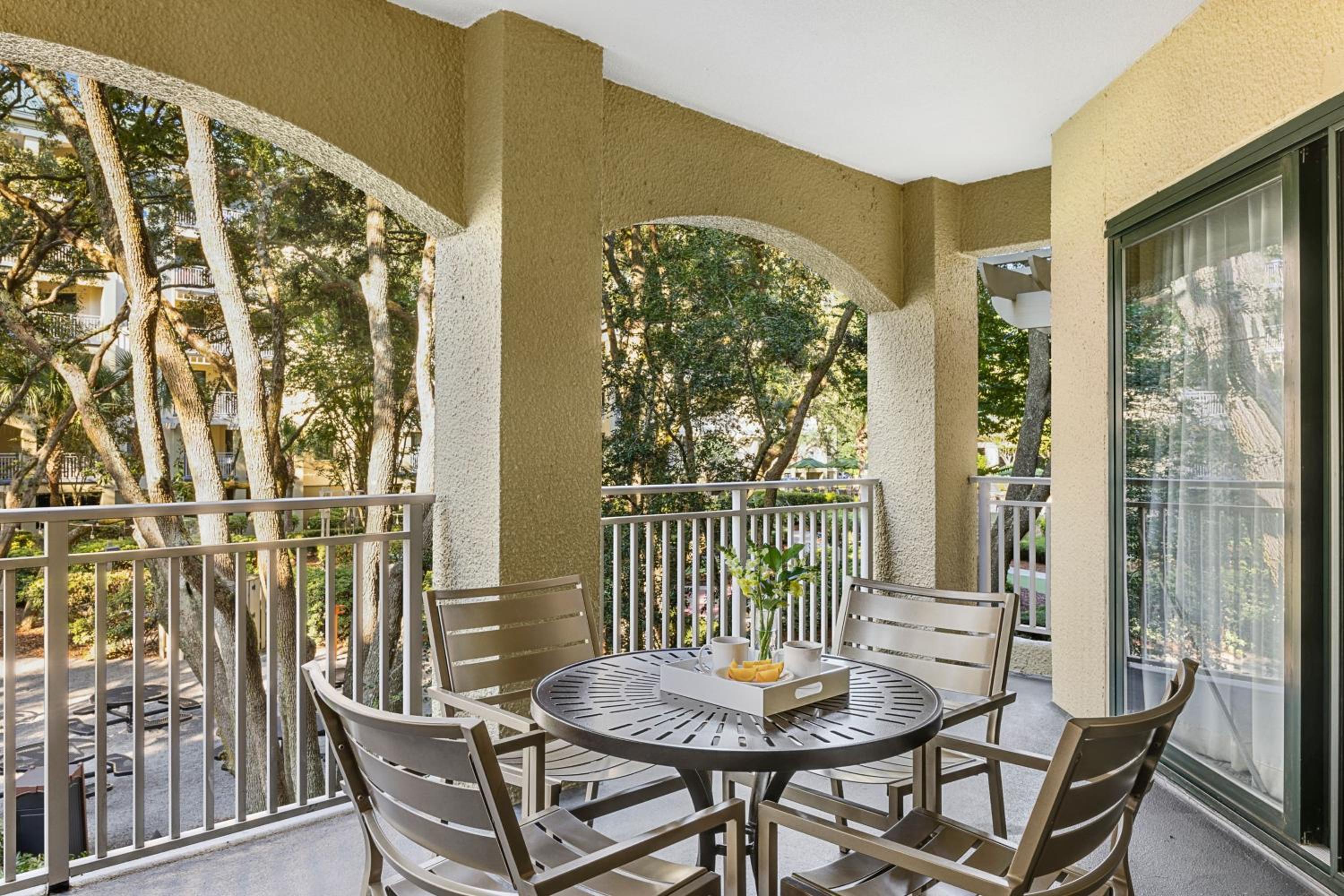 Two-Bedroom Villa with One King and Two Queen Beds with Sofa Bed and Courtyard View