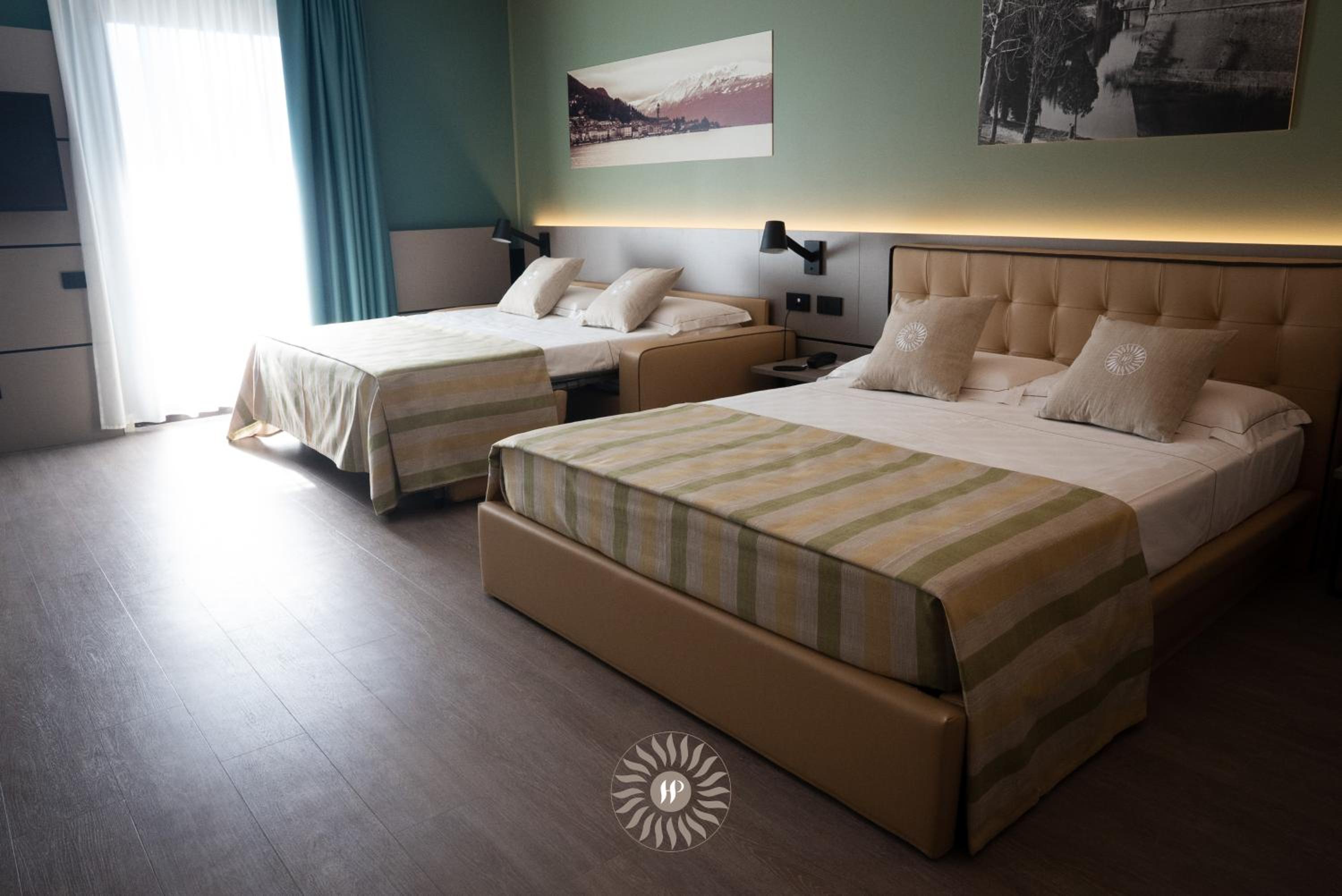 Superior Quadruple Room With Balcony and Partial Lake View - Photo 1