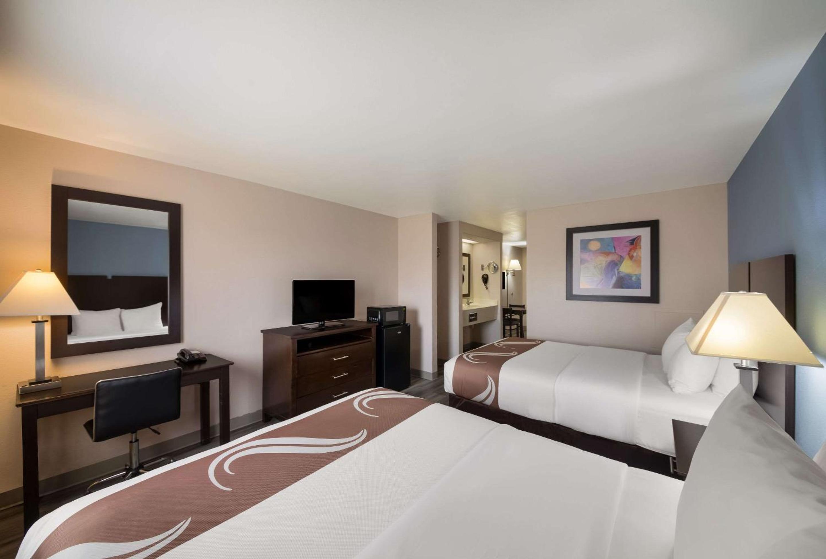 Queen Suite with Two Queen Beds and Sofa Bed - Photo 1