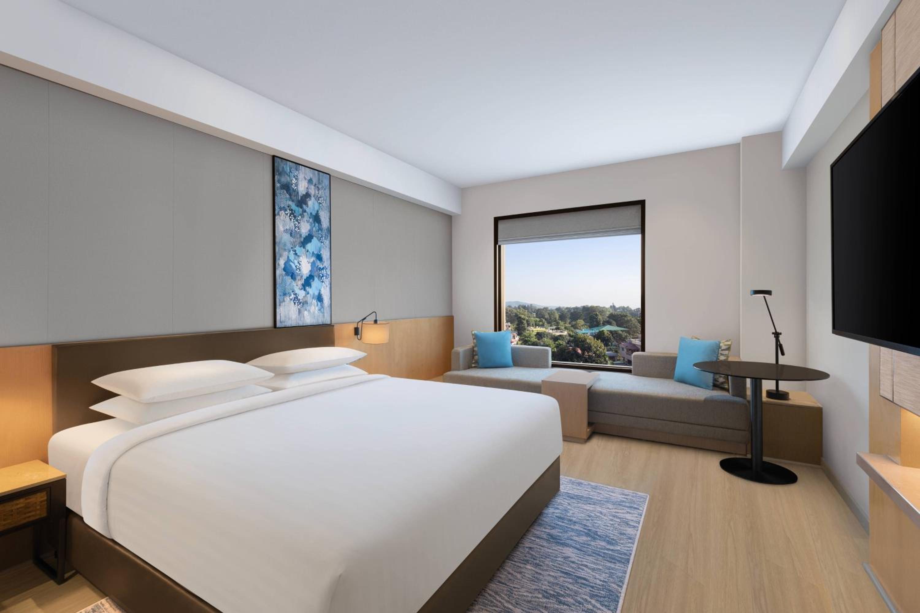 Deluxe King Room with Sofa Bed - Photo 6
