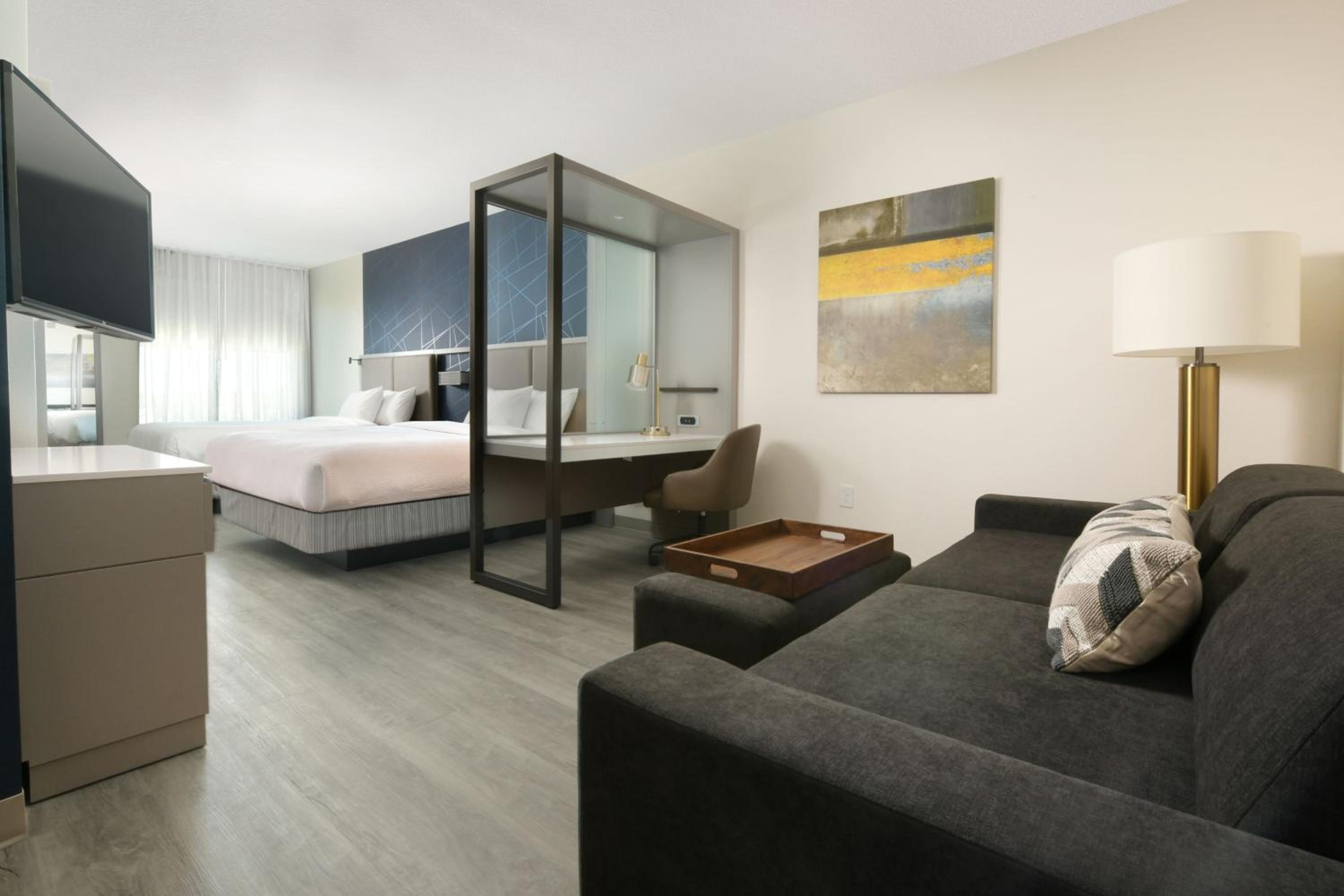Queen Suite with Two Queen Beds and Sofa Bed - Photo 1
