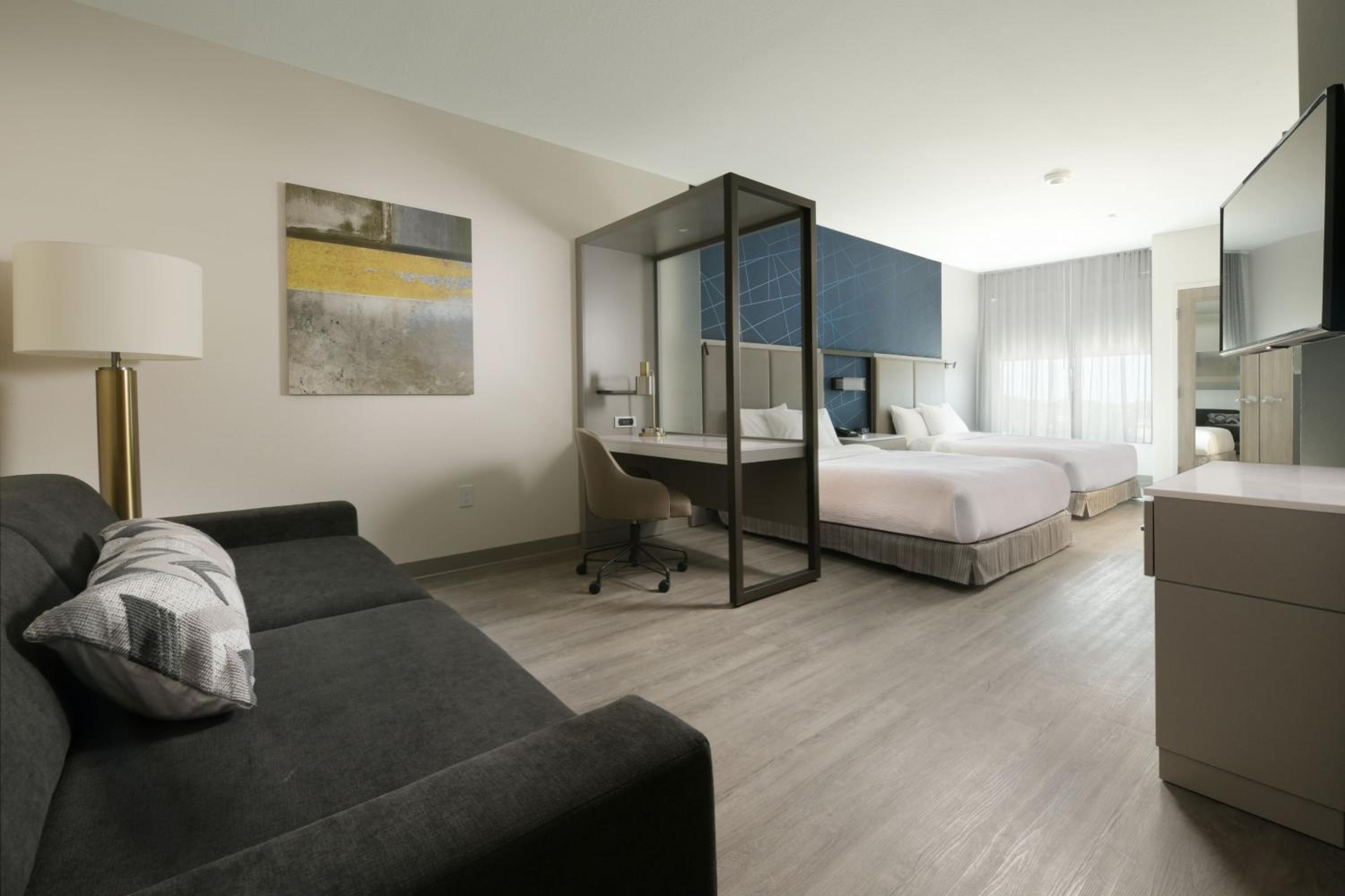 Queen Suite with Two Queen Beds and Sofa Bed - Photo 3