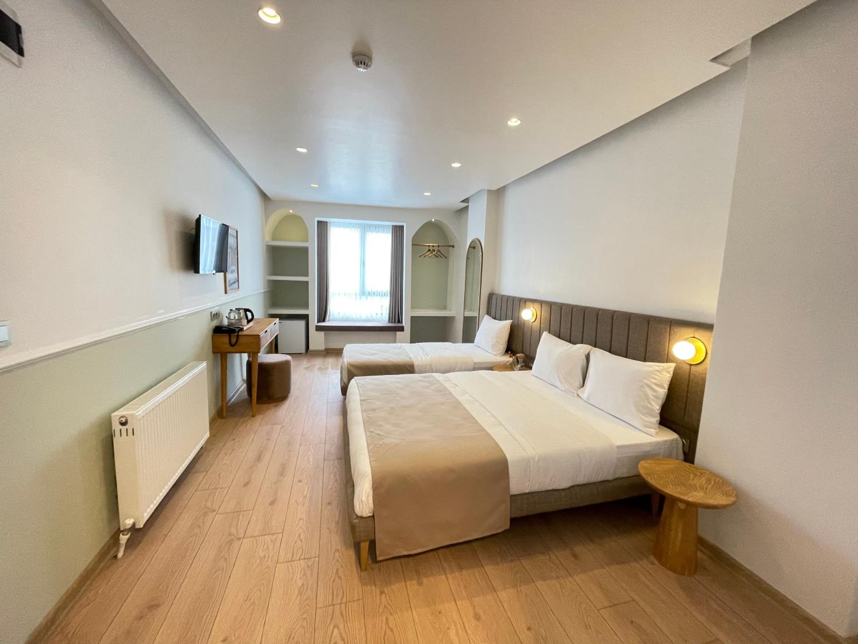 Deluxe Triple Room - Photo 12