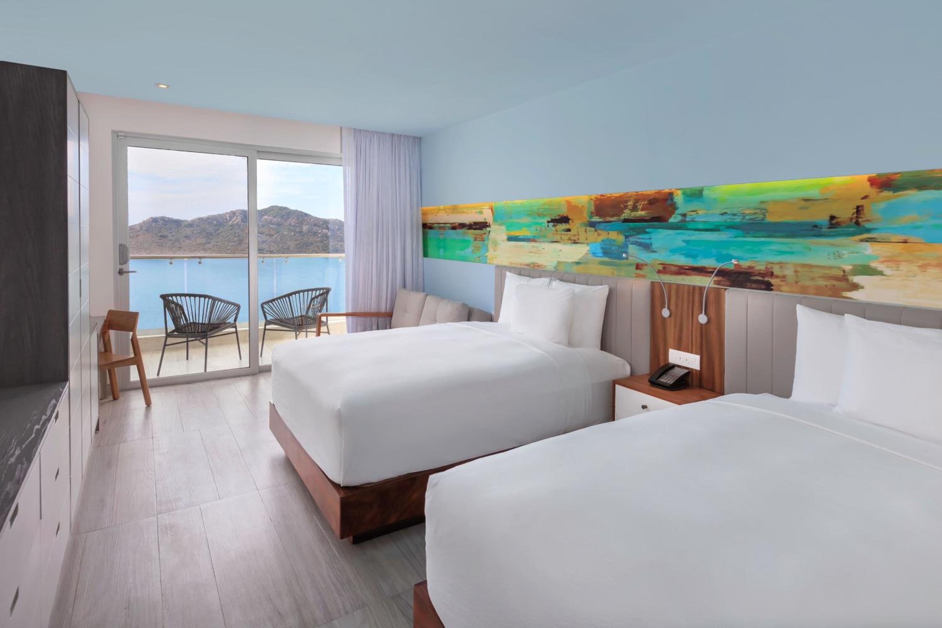 Deluxe Queen Room with Two Queen Beds, Balcony and Ocean View - Photo 1