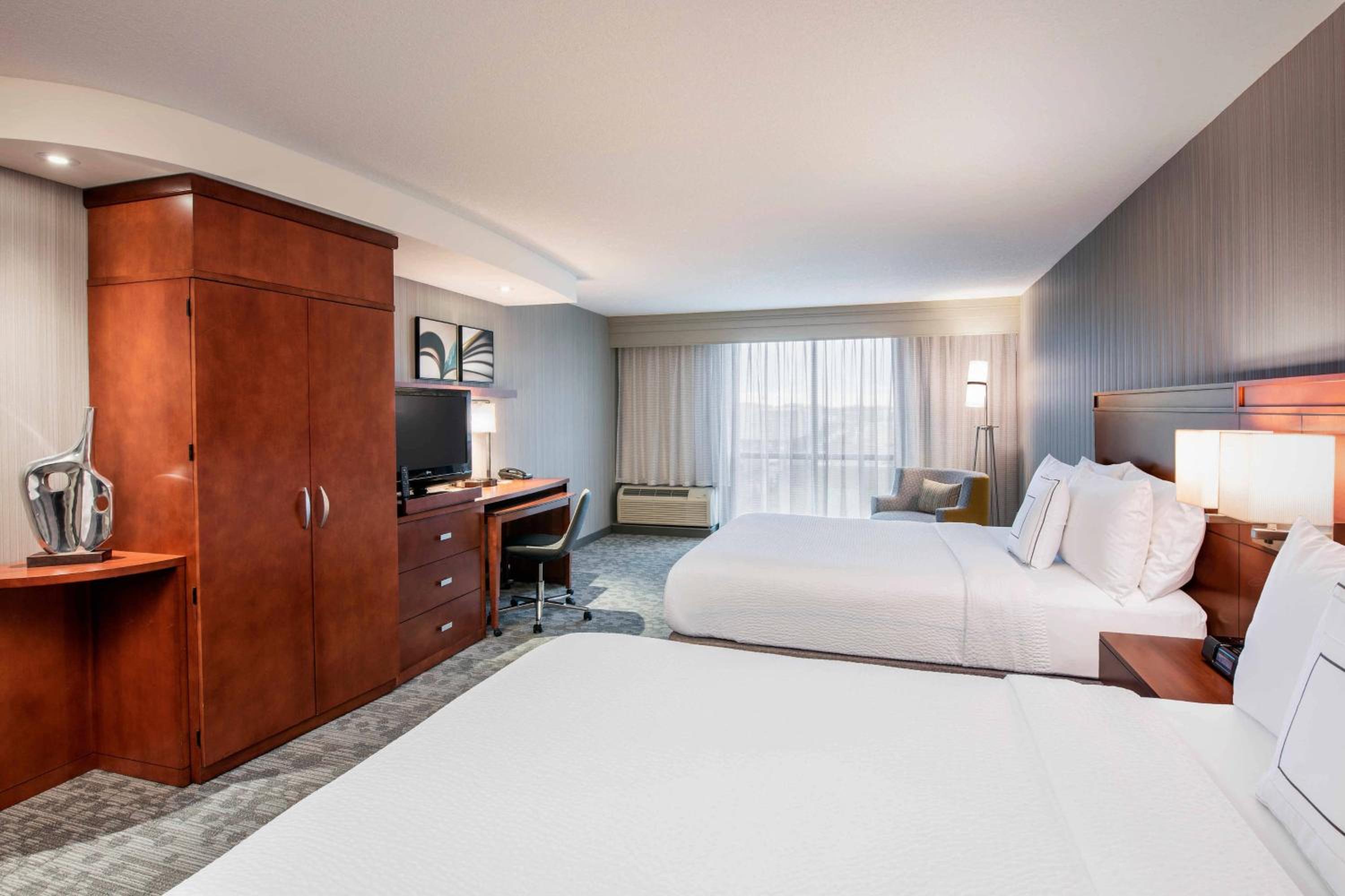 Larger Queen Room with Two Queen Beds - Photo 1