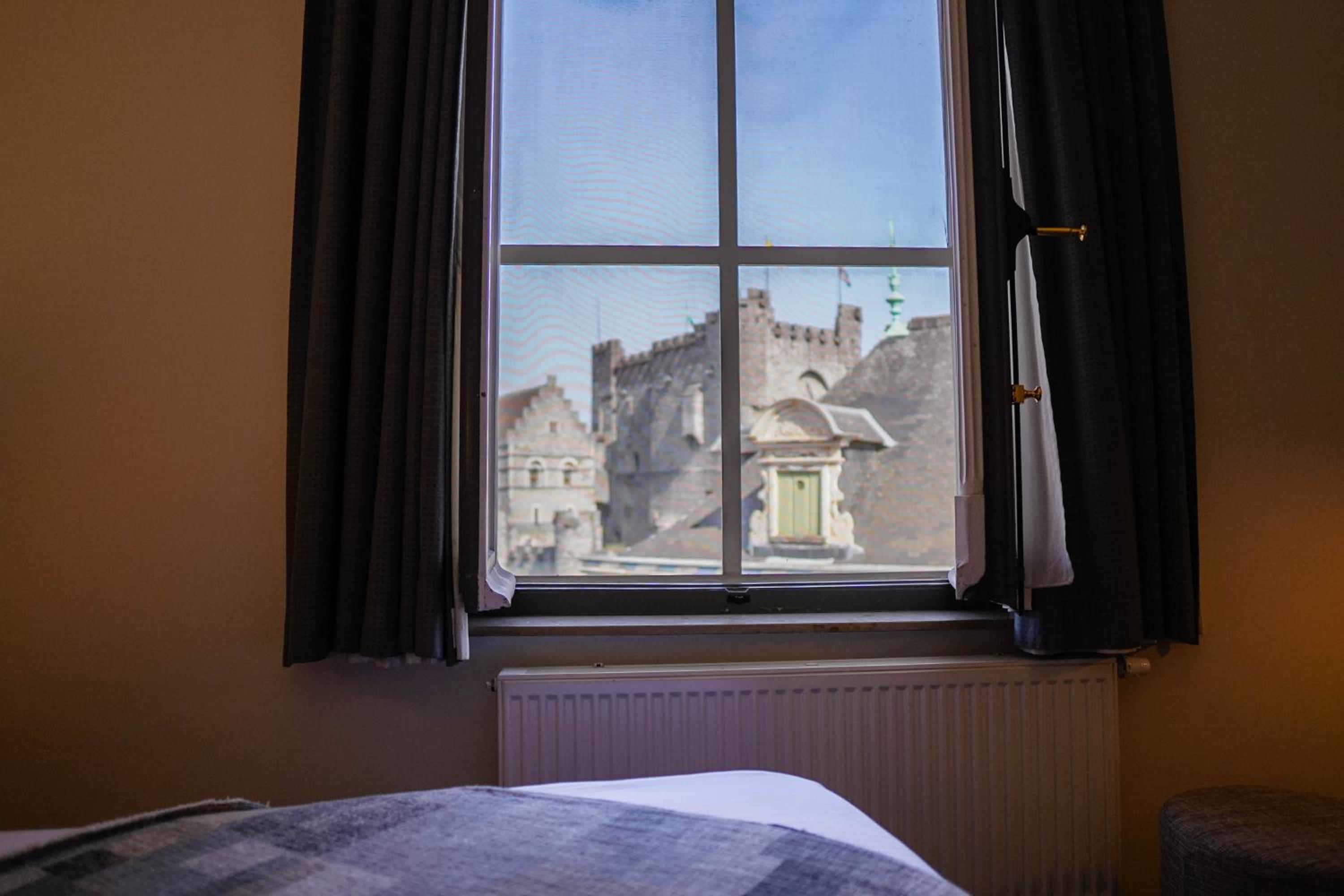 window with a view of a castle in the background