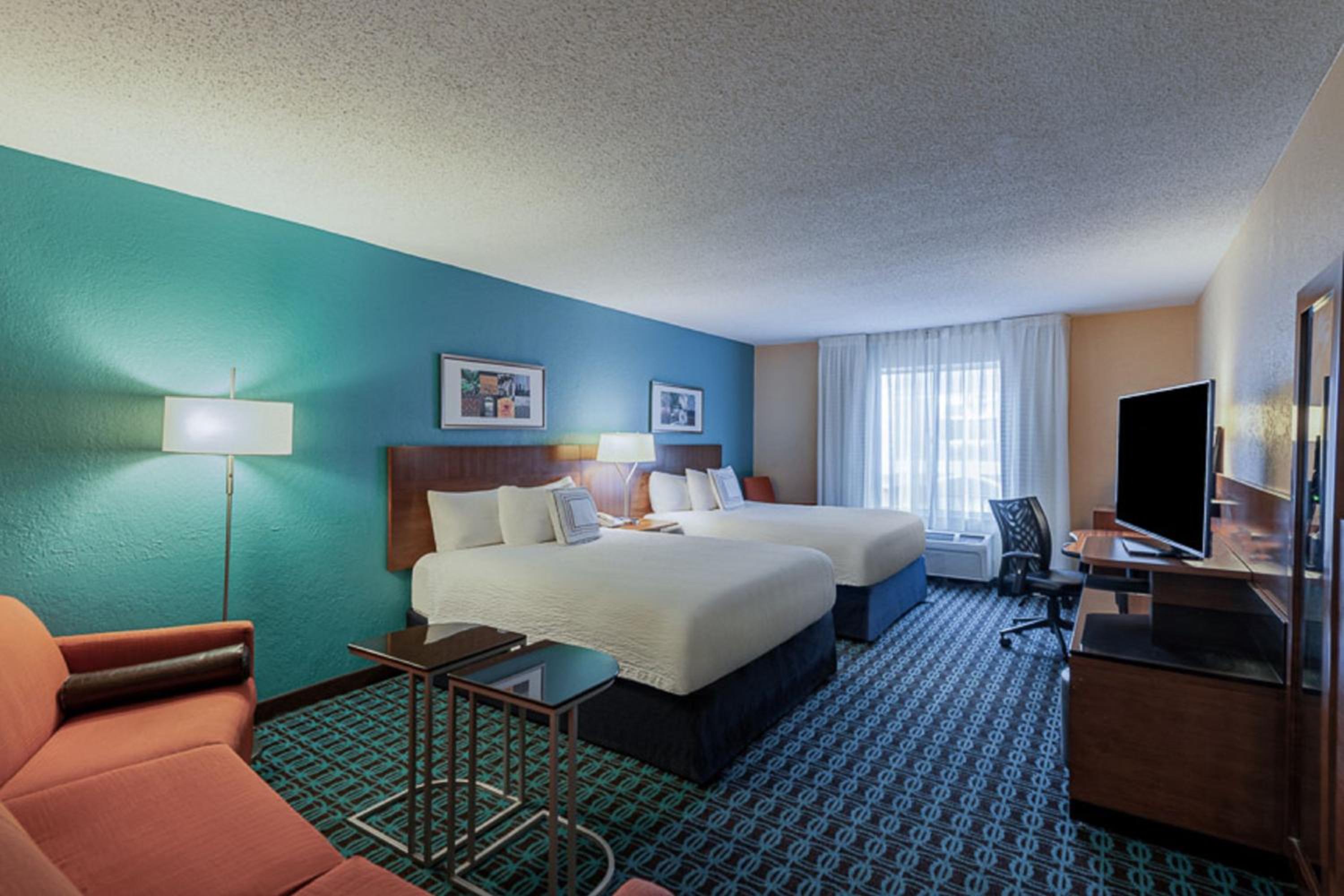 Queen Suite with Two Queen Beds and Sofa Bed - Photo 1