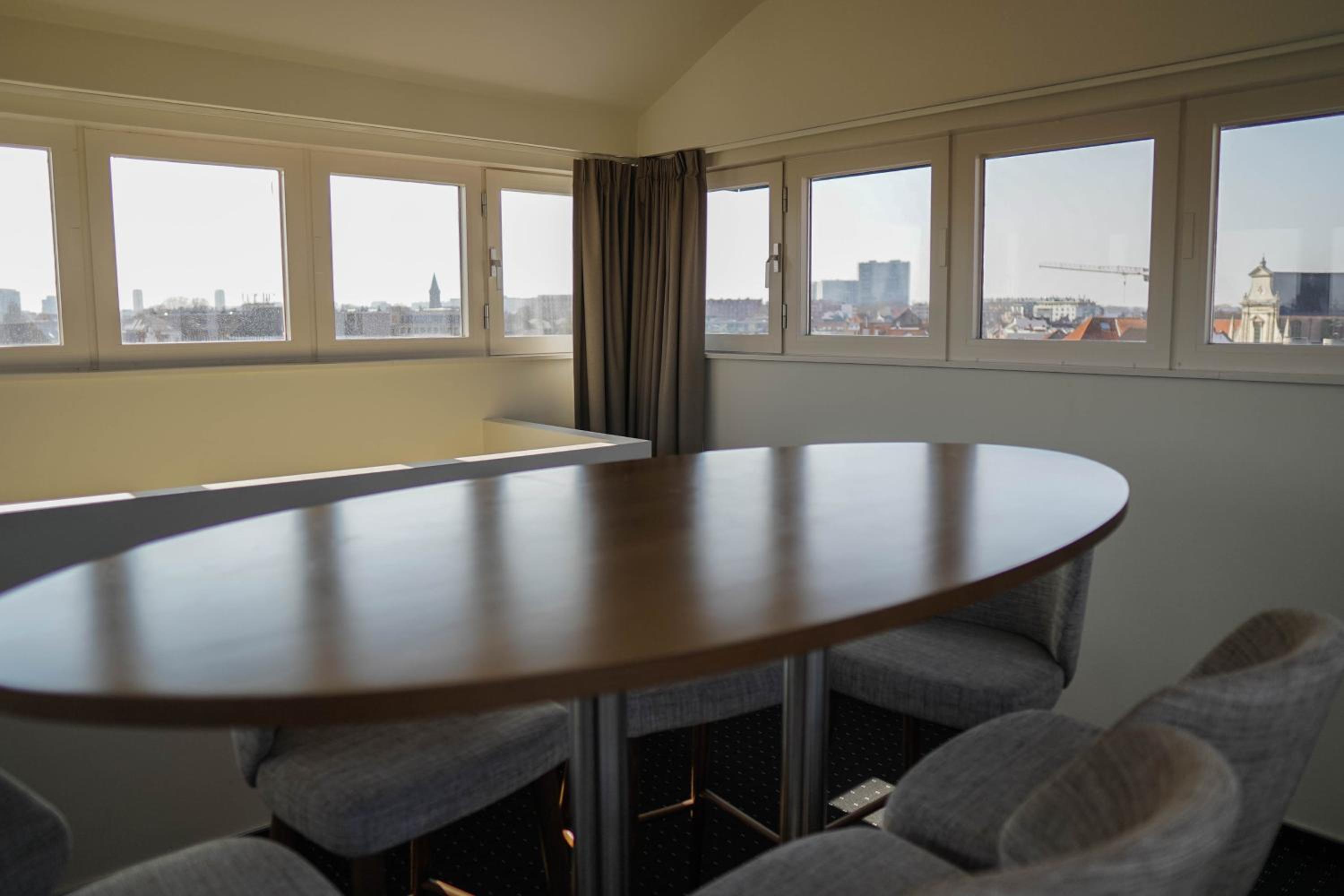 dining room table with chairs and a view of the city