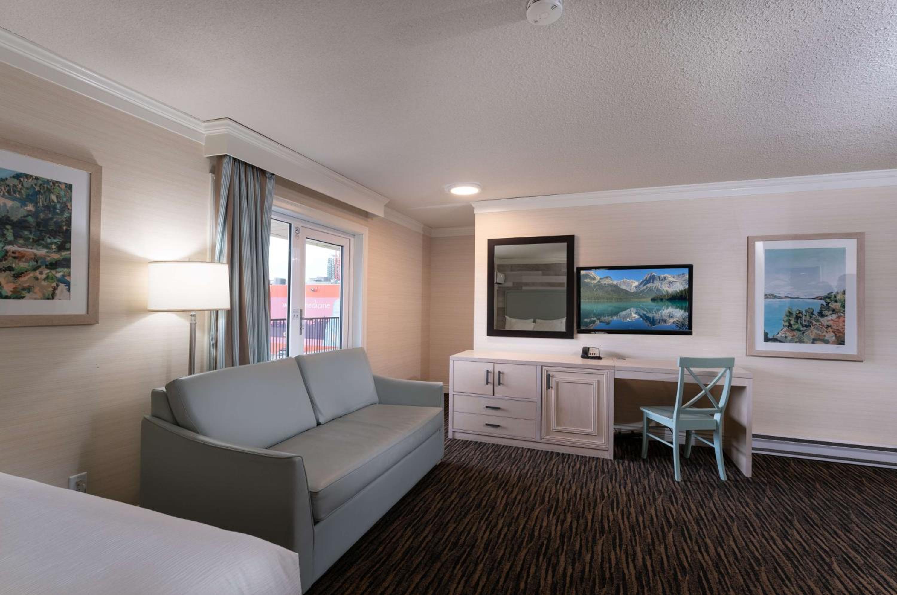 Queen Room with Two Queen Beds with Sofa Bed - Photo 2