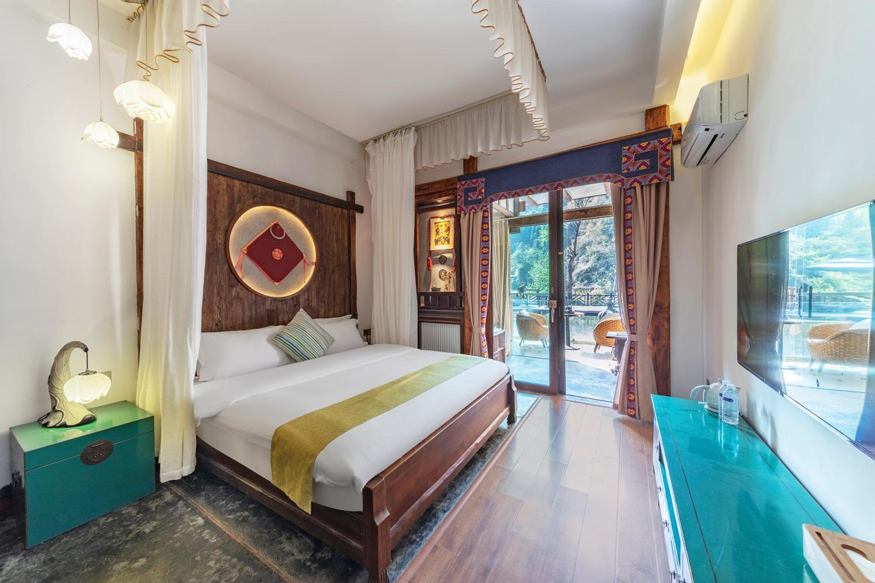 Queen room with Lotus Pond  View, Balcony, Bathtub, and Fireplace photo 1