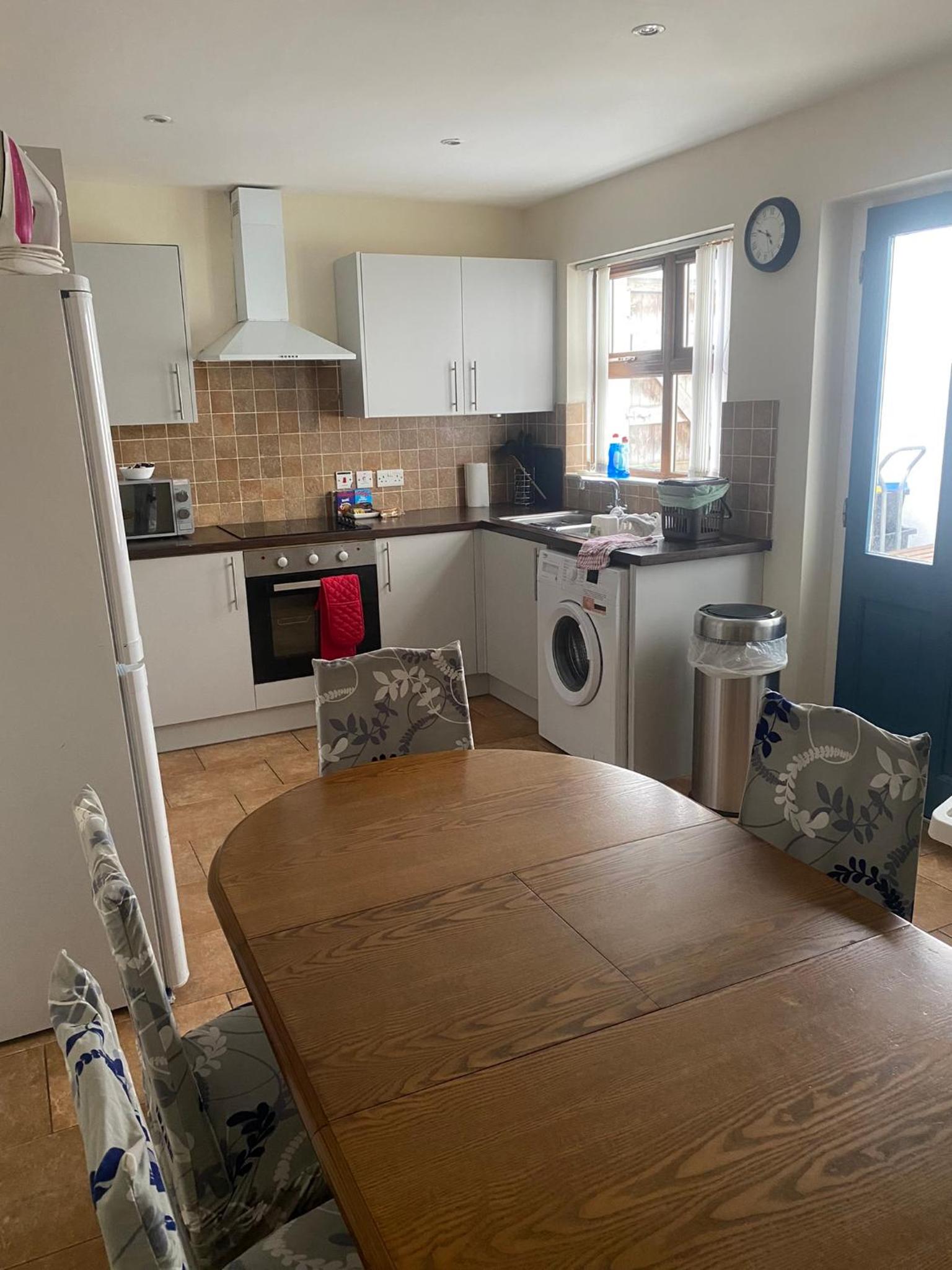 Three-Bedroom House - Photo 32