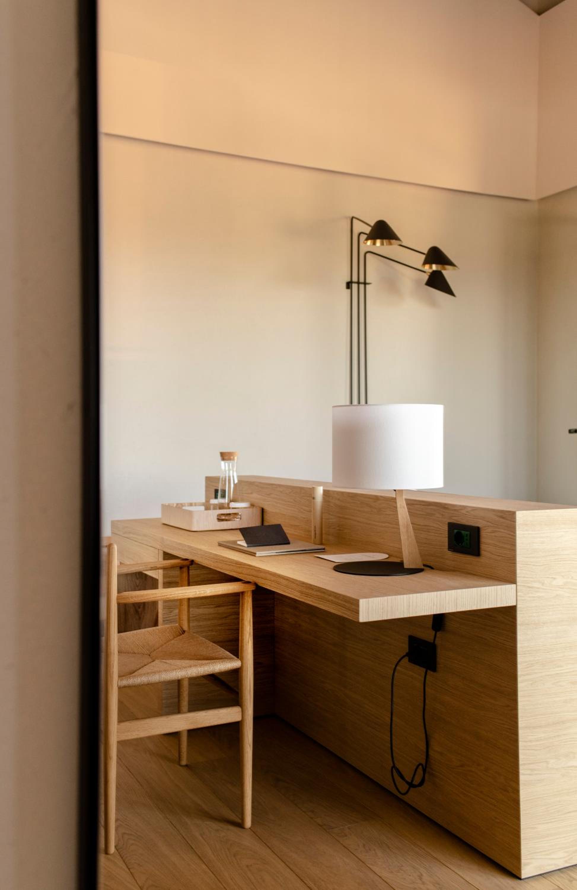 photo of a desk with a lamp and a chair