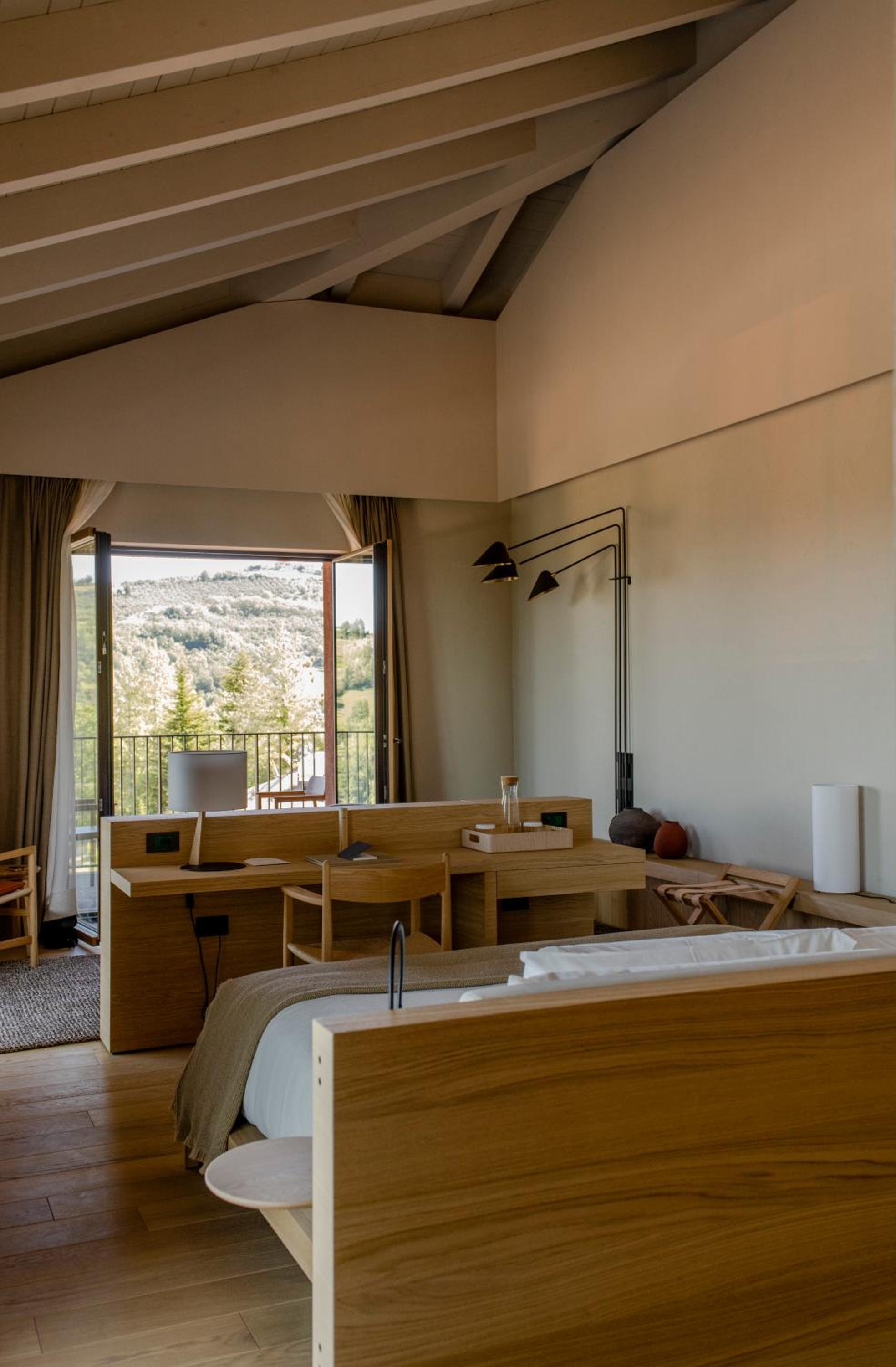 bedroom with a jacuzzi tub in the corner
