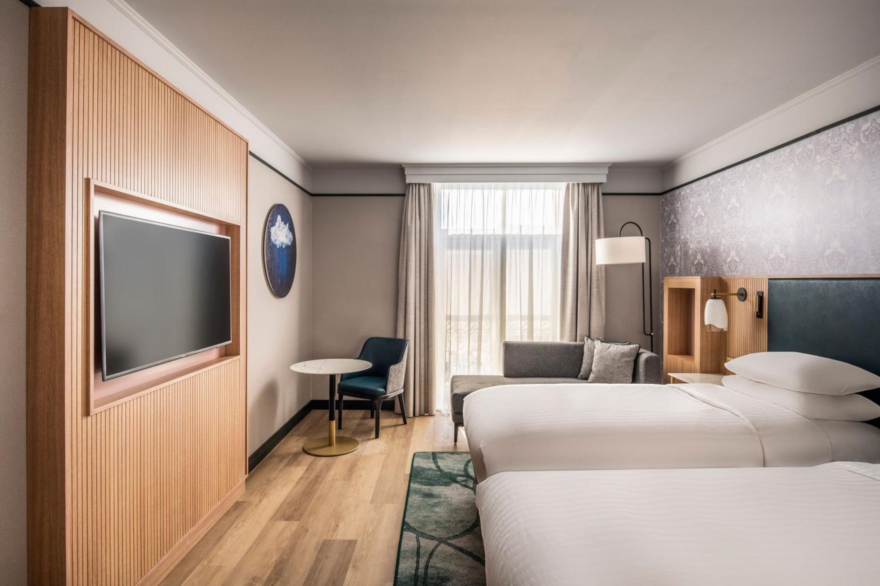 Two-Bedroom Connecting Room with One King and Two Twin Beds