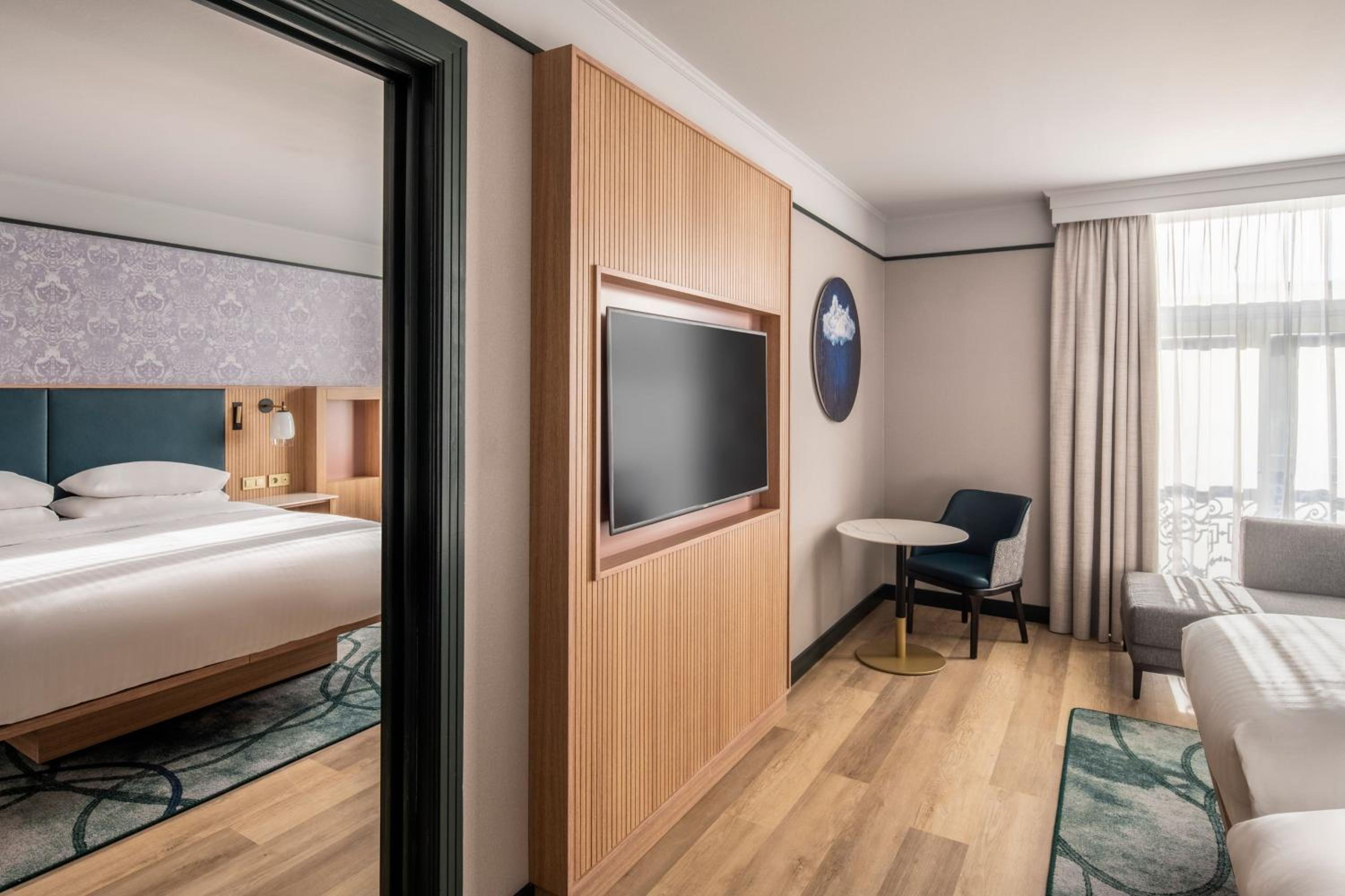 Two-Bedroom Connecting Room with One King and Two Twin Beds