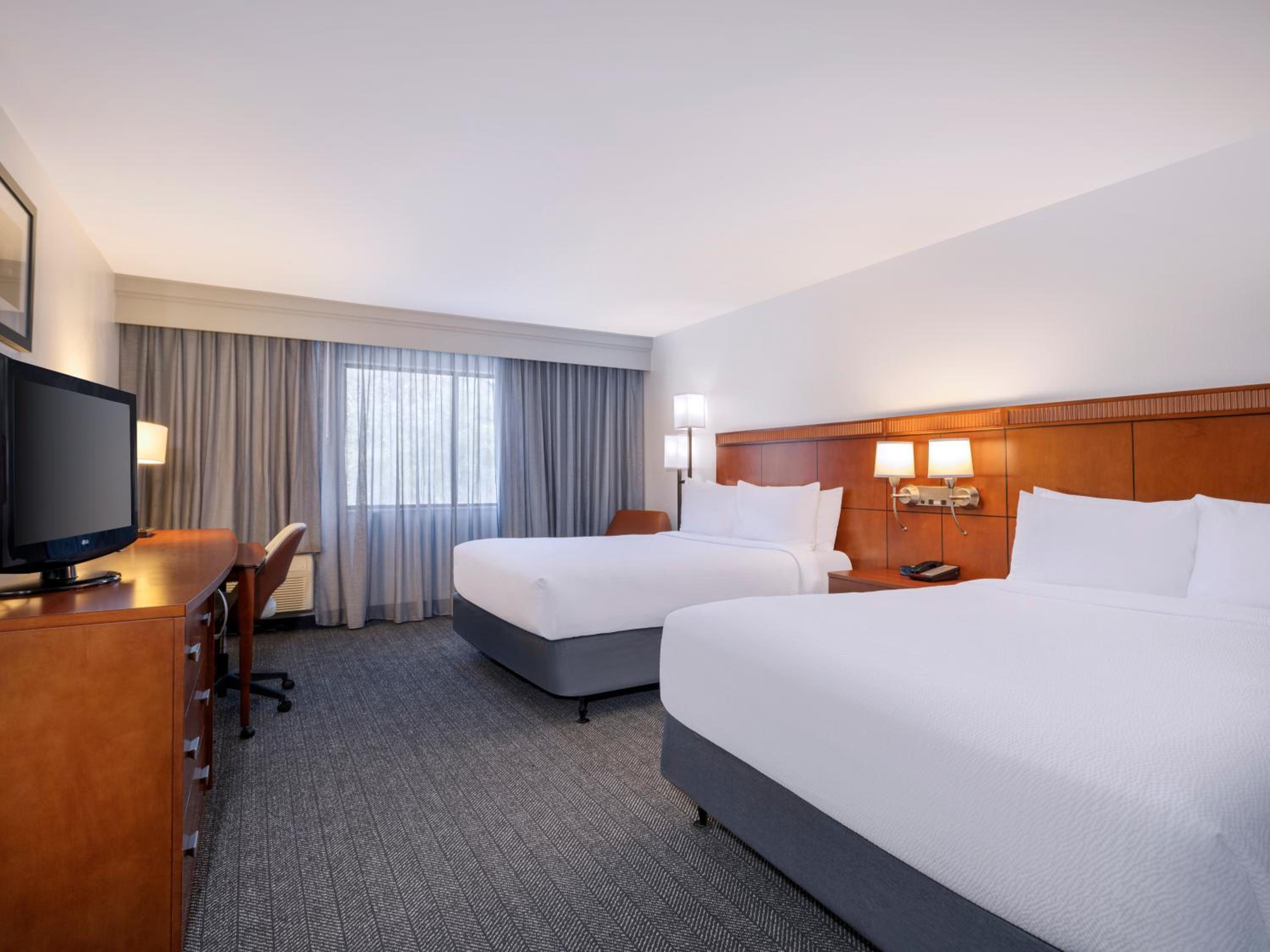 Queen Room with Two Queen Beds - Photo 1