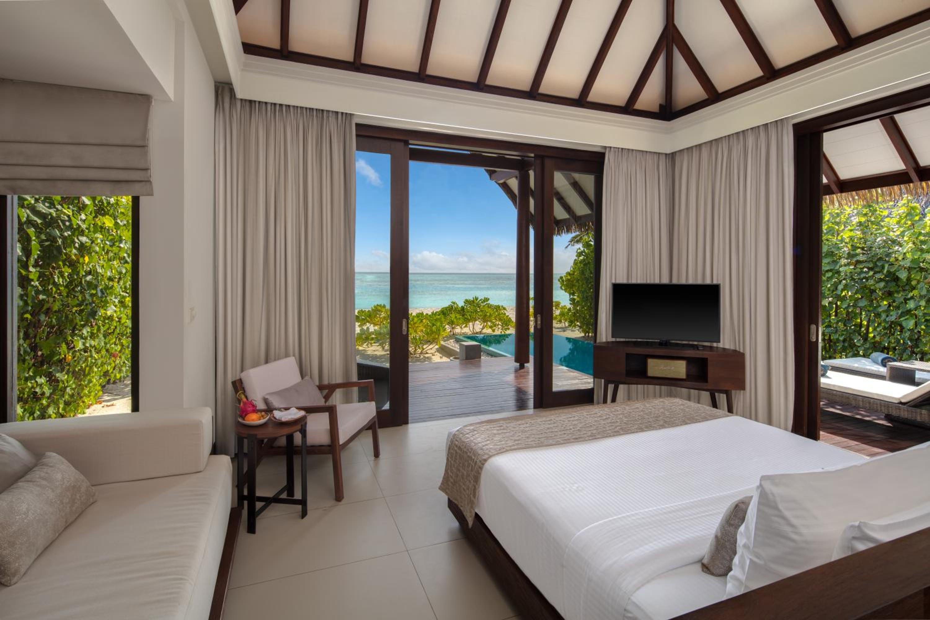 Sunset Pool Beach Villa – Personalized Butler Service | Private Sea Plane Lounge Access | Kids Club With Optional Nanny Services | Maldivian Traditional Village Experience | Access To 5 Exceptional Dine-Around Outlets