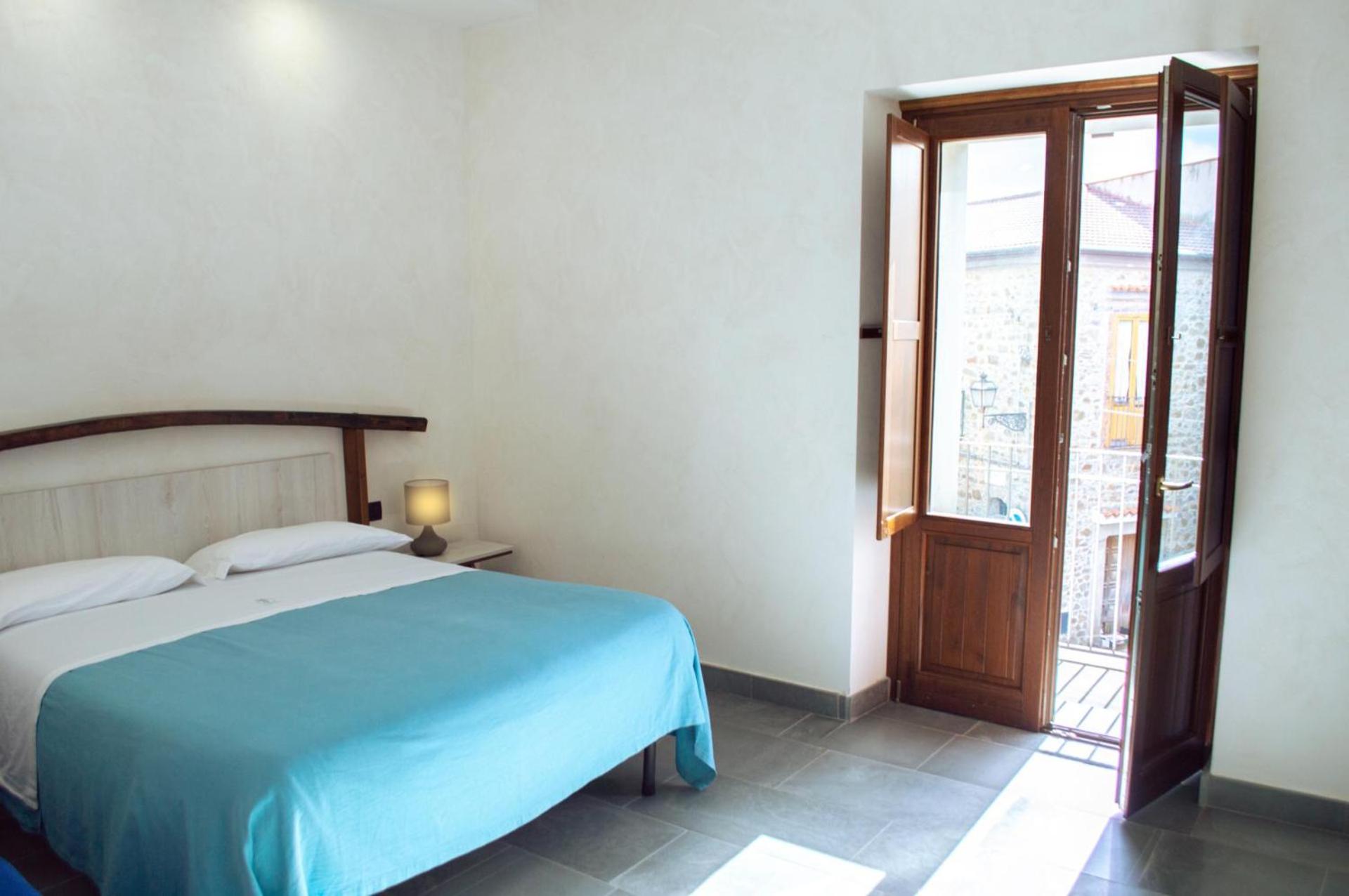 Quadruple Room with Balcony - Photo 1