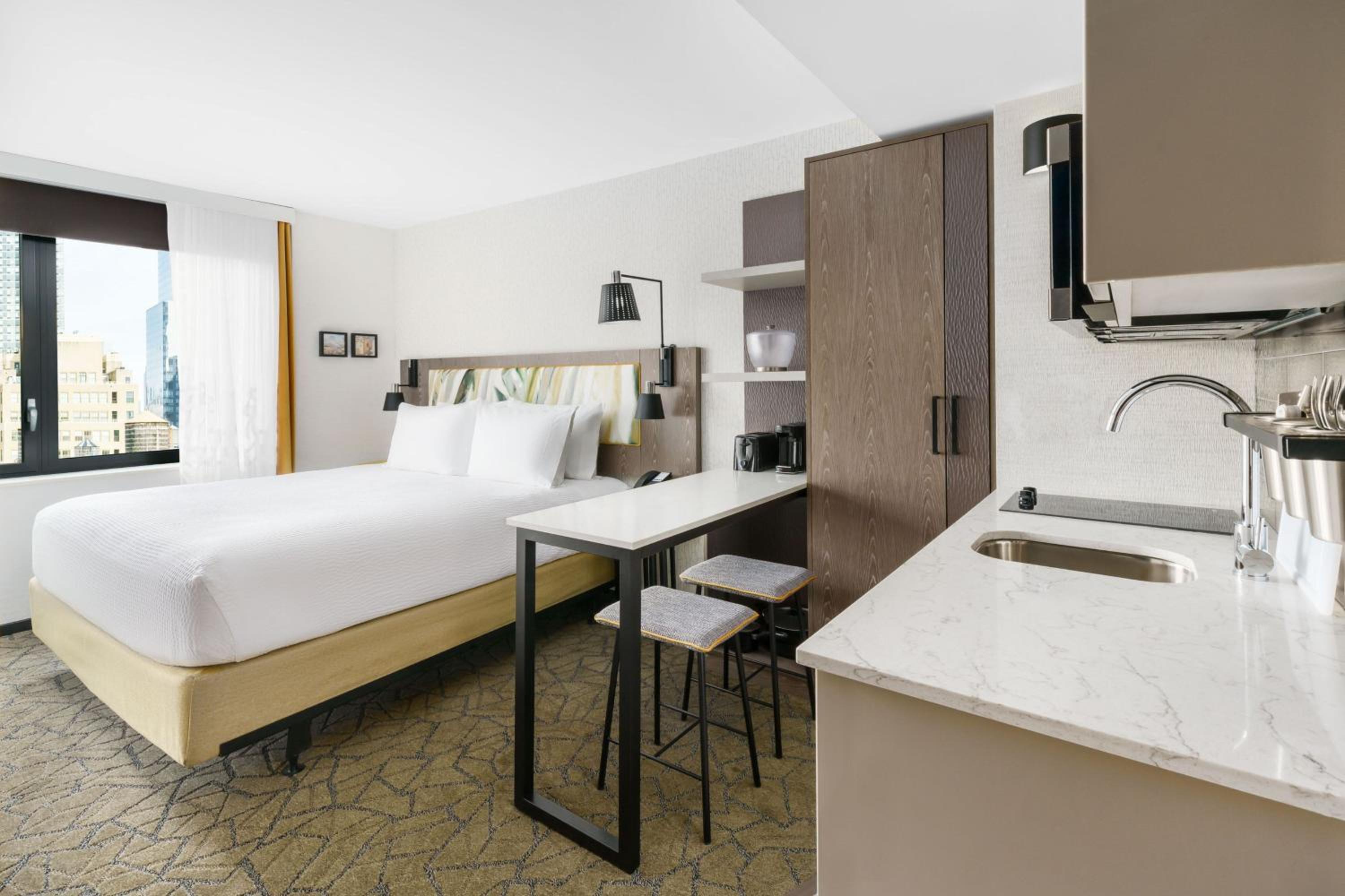 King Studio with Partial City View and Full Kitchenette - Mobility/Hearing Accessible w/Roll In Shower