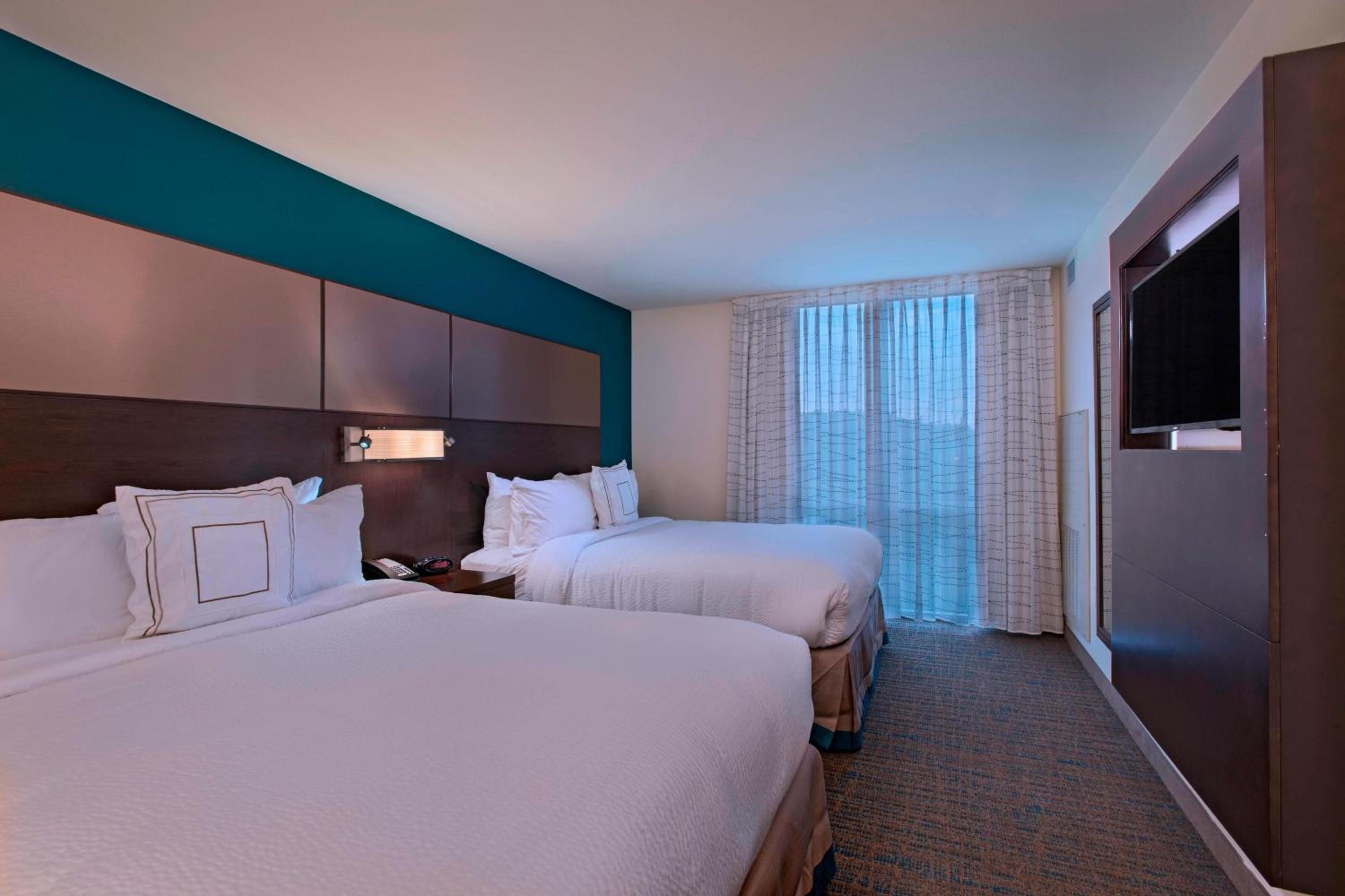 One-Bedroom Suite with Two Queen Beds and Sofa Bed - Mobility and Hearing Accessible with Roll-in Shower photo 1