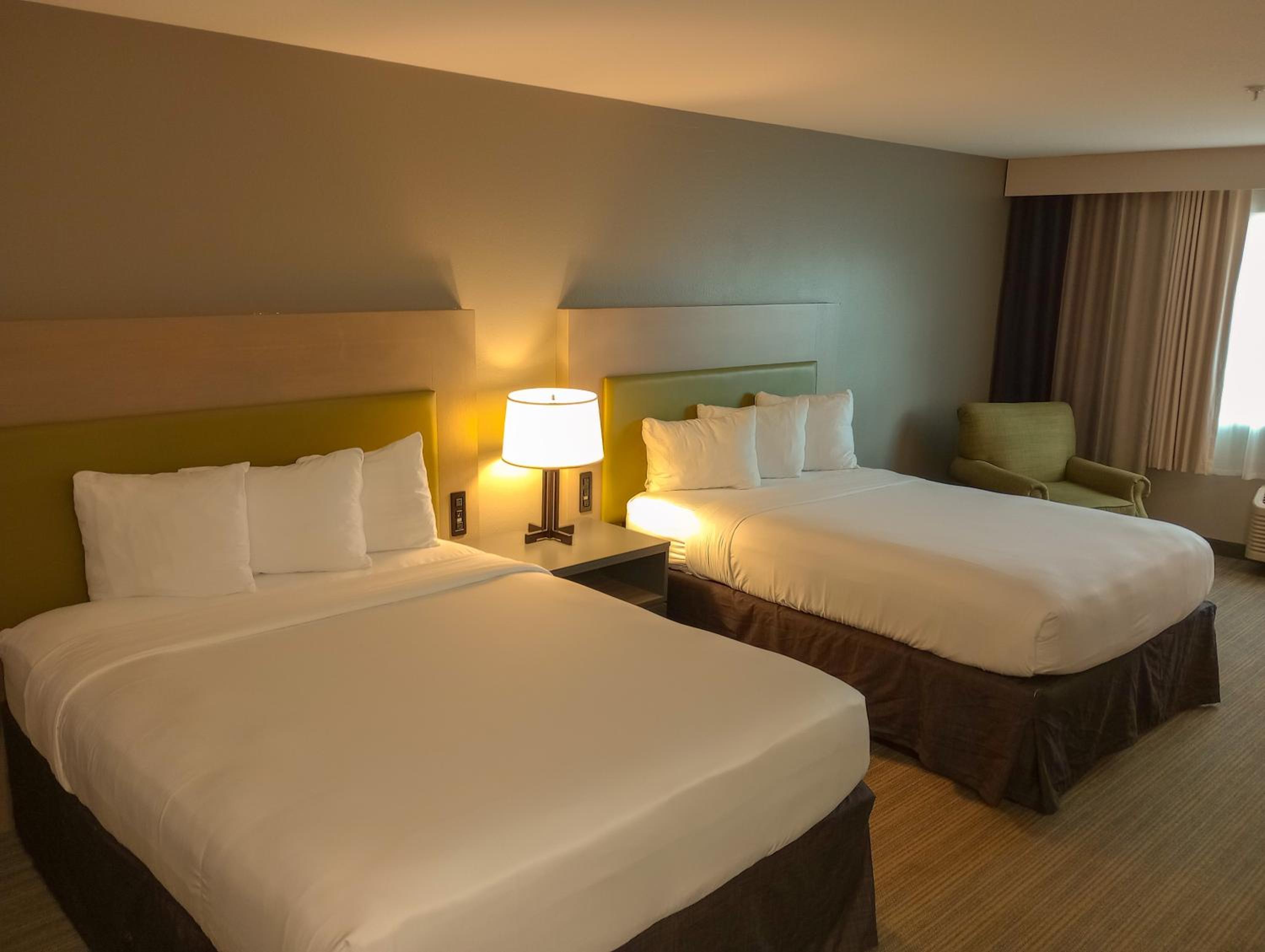 Premium Queen Room with Two Queen Beds - Non-Smoking - Photo 1