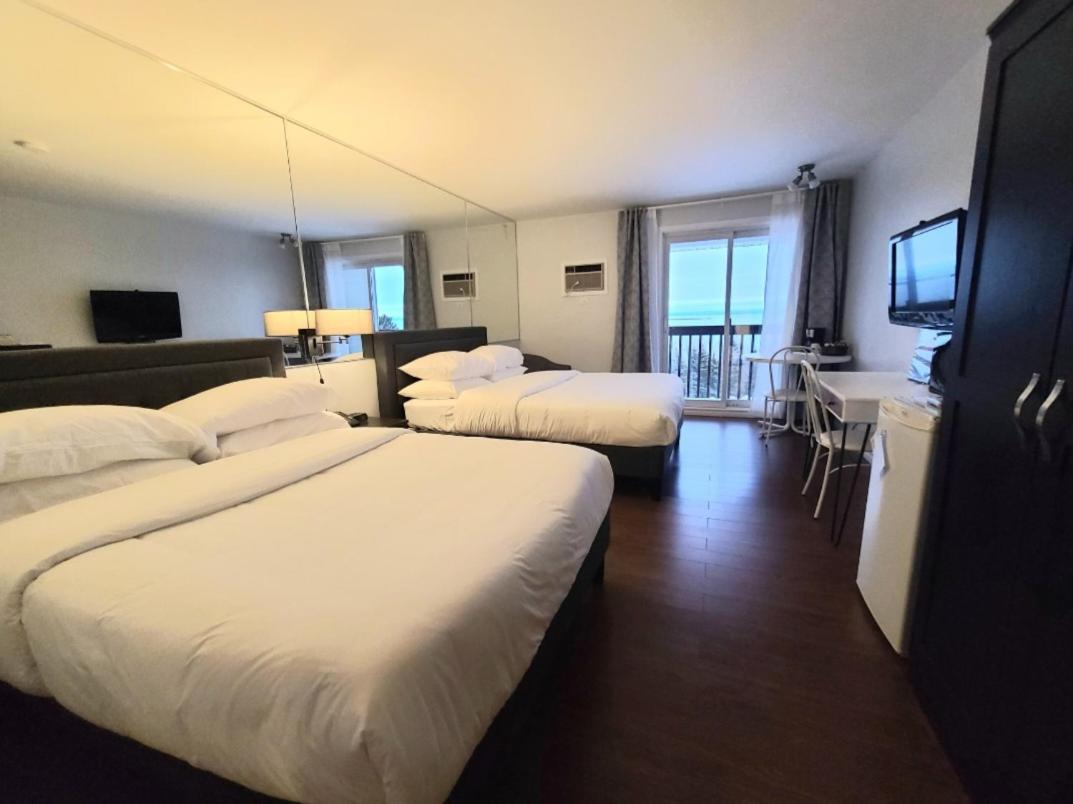 Deluxe Queen Room with Two Queen Beds - Photo 1