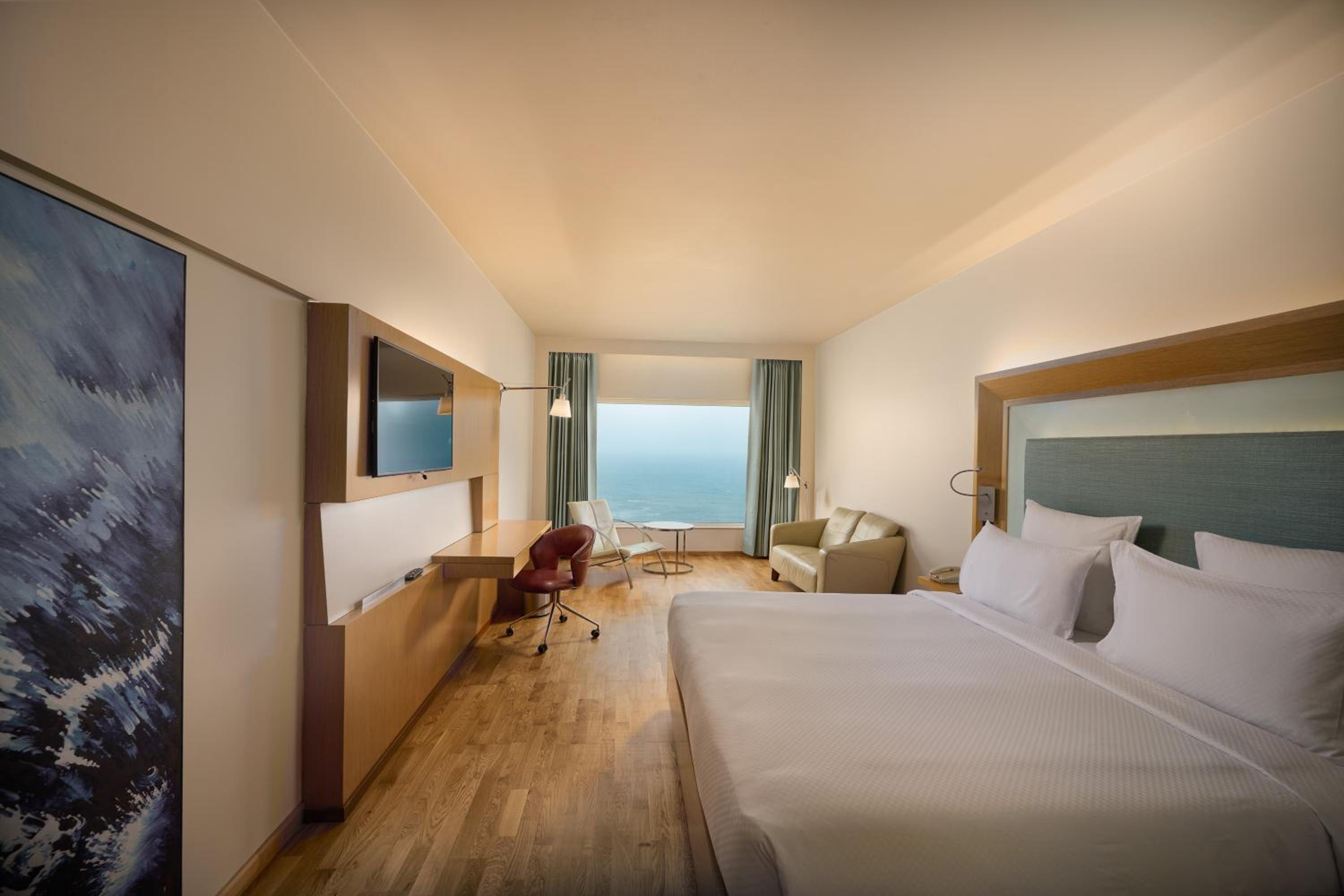 Premier Room with 1 King Bed Ocean View with Premier Lounge Access along with 2 Pieces of Laundry per room per night on non-cumulative basis.