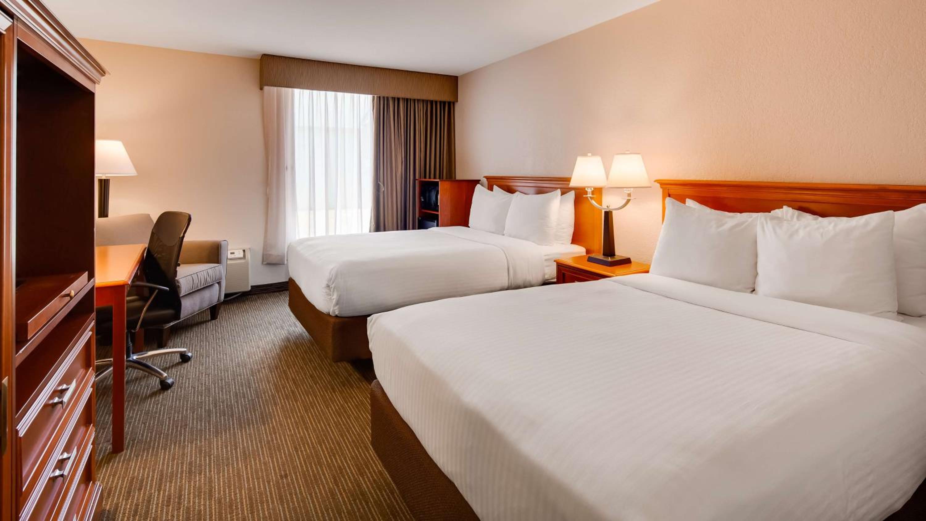 Queen Room with Two Queen Beds - Photo 1