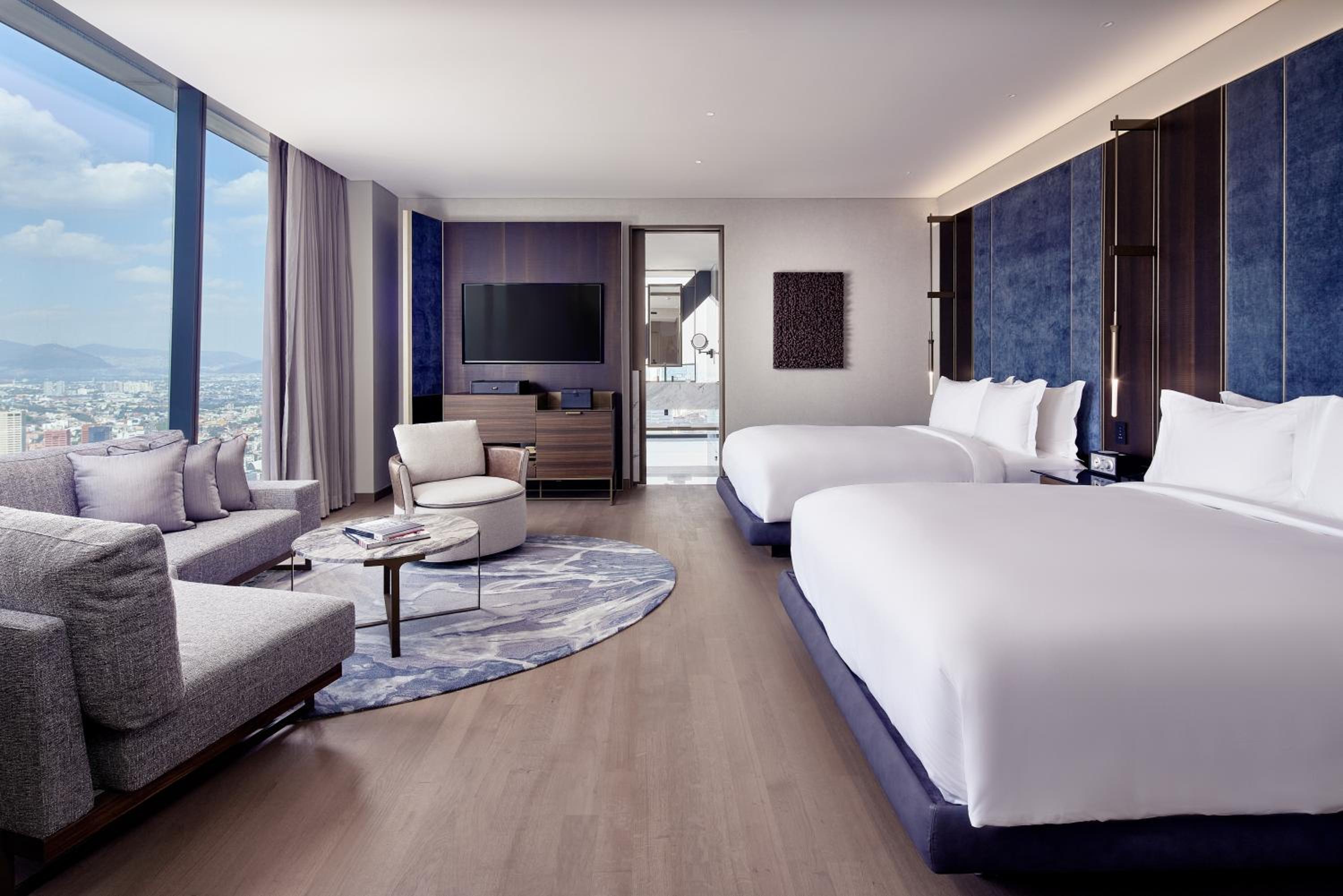 Deluxe Corner Queen Room with Two Queen Beds and City View