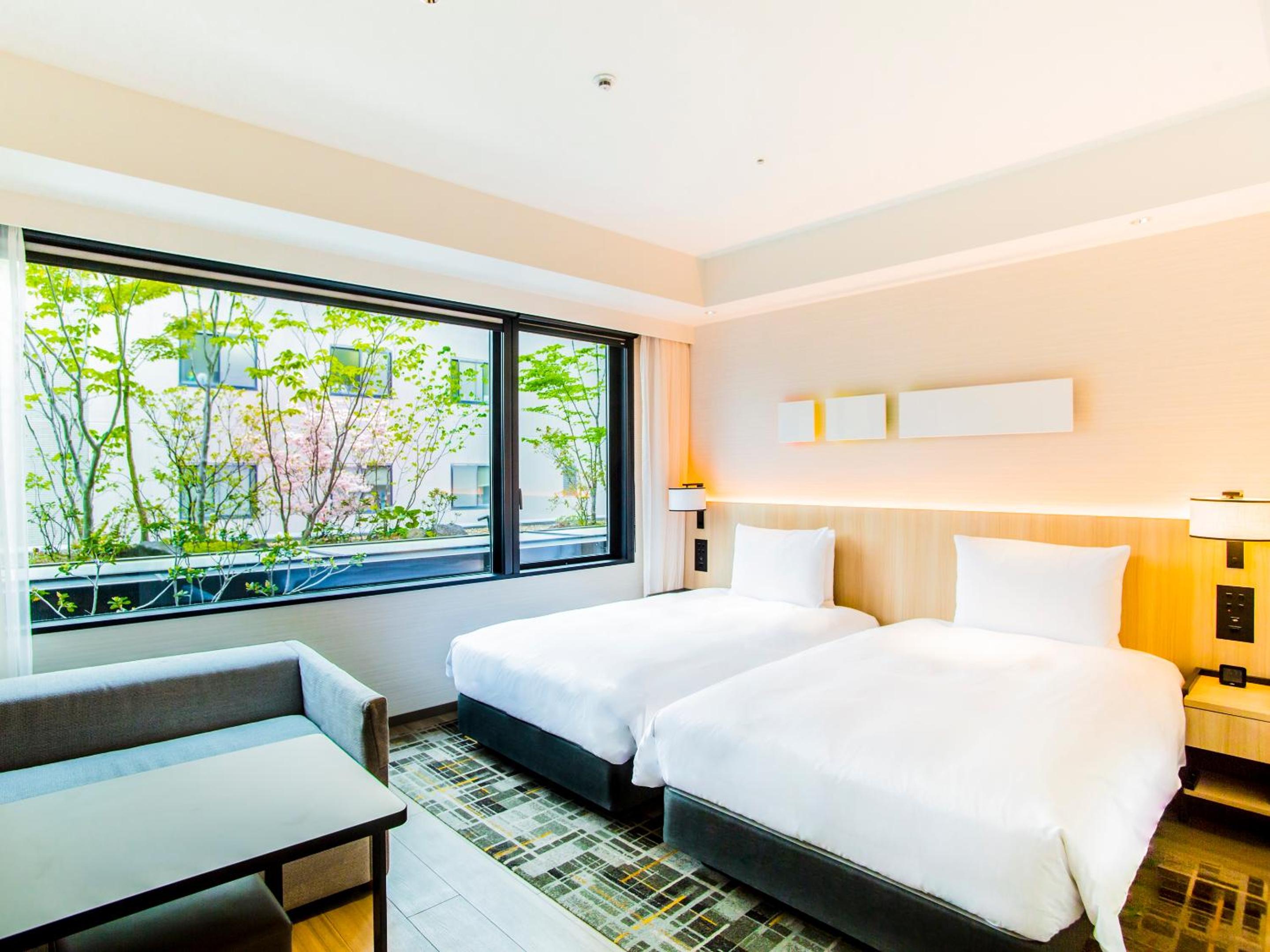 Twin Room with Bathtub - Garden View - Photo 1